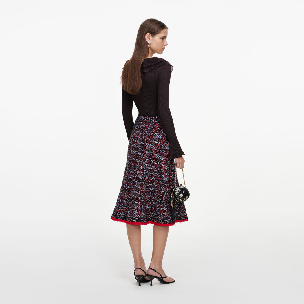 Back view of a woman wearing the Multi Textured Knit Midi Skirt