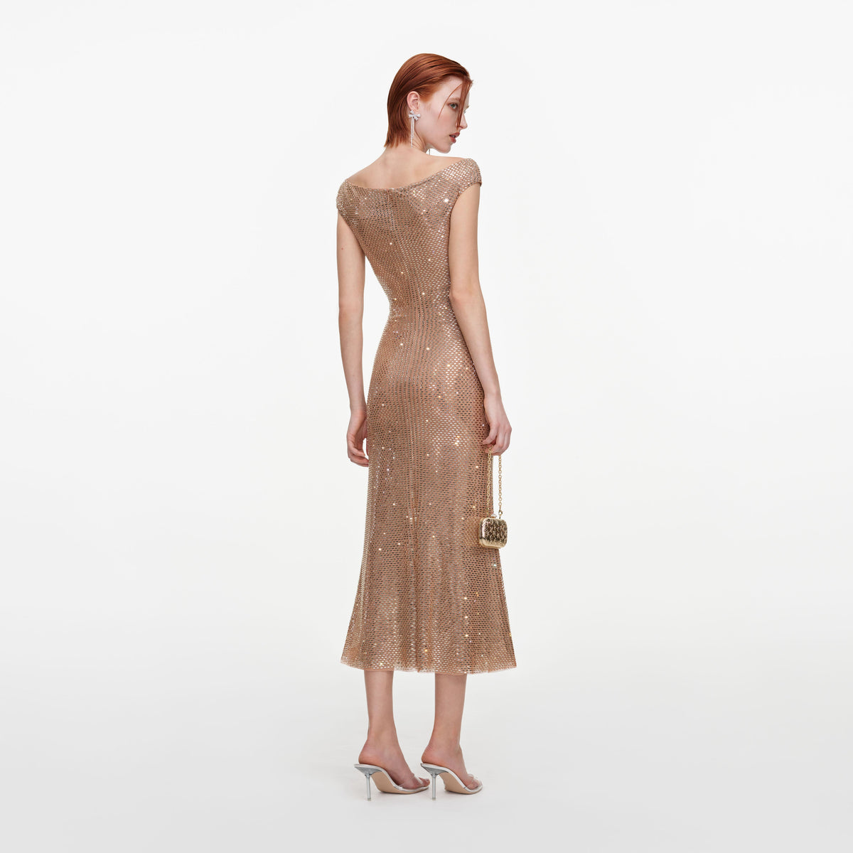 Back view of a woman wearing the Gold Rhinestone Off Shoulder Midi Dress
