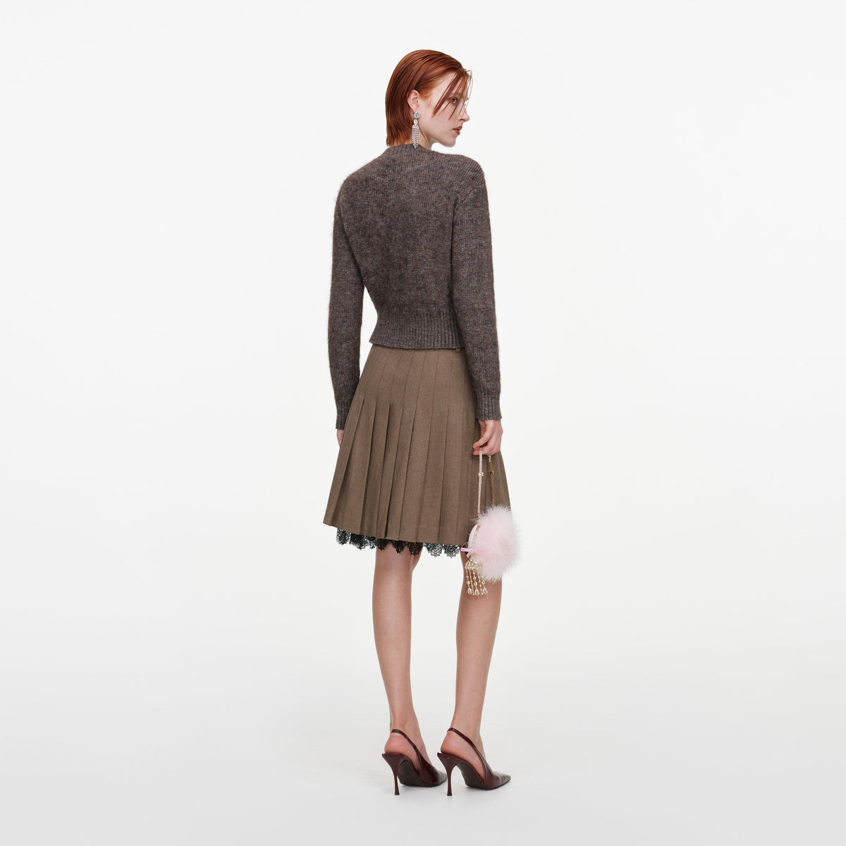 Back view of a woman wearing the Brown Twill Lace Pleated Midi Skirt