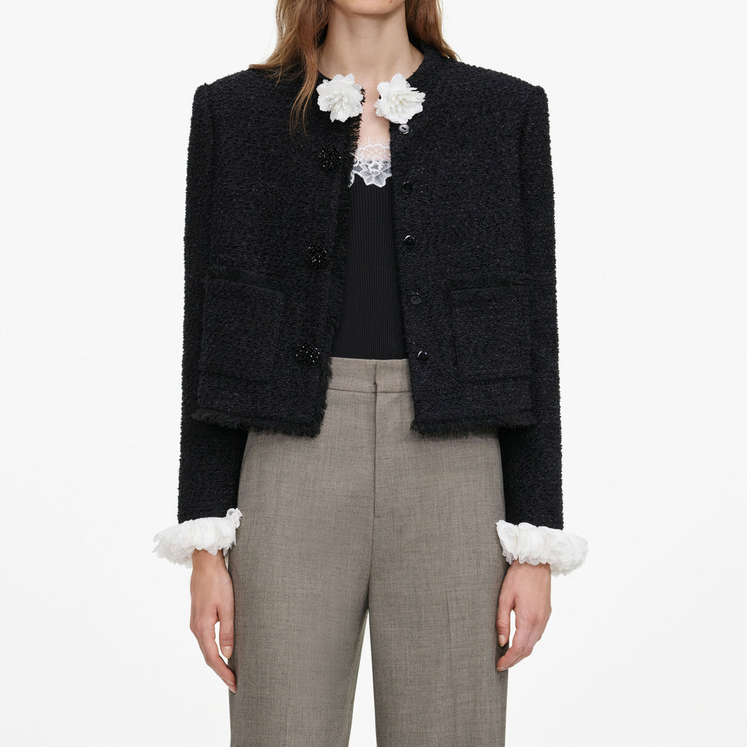 A close up of a woman wearing the Brown Twill Tailored Trousers