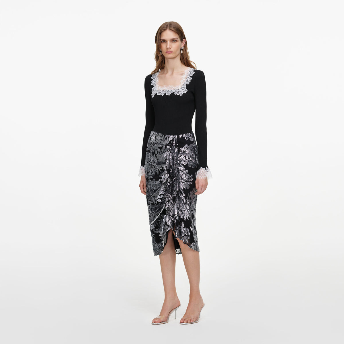 Side view of a woman wearing the Silver Fil Coupe Midi Skirt
