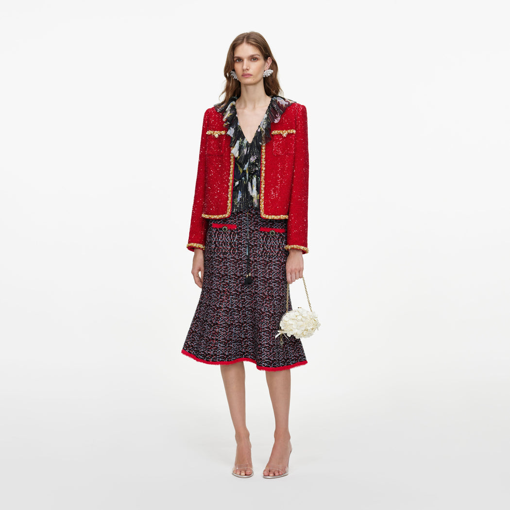 Front view of a woman wearing the Red Sequin Jacket