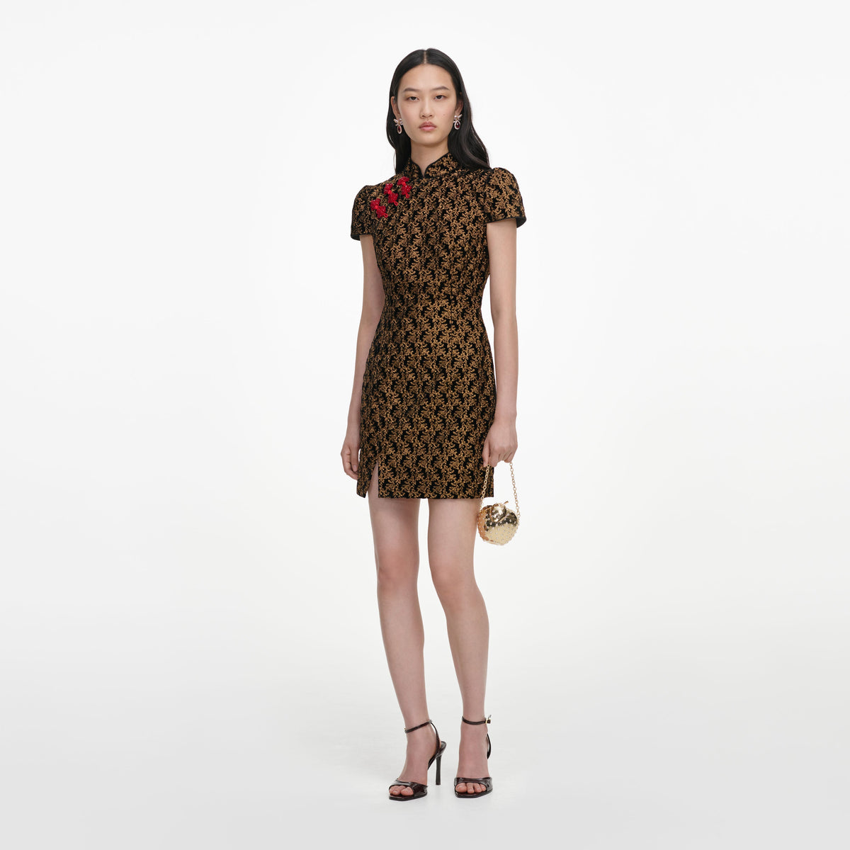 Side view of a woman wearing the Black Velvet Flower Mini Dress