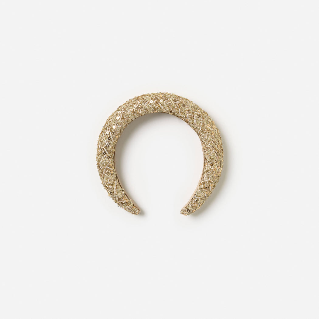 Front view of a girl wearing the Gold Boucle Head Band