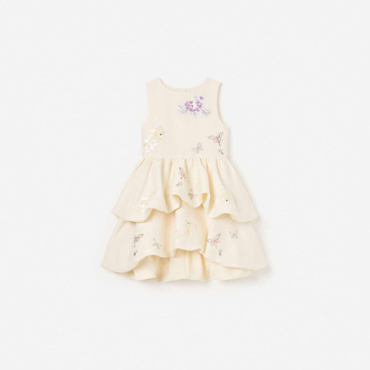 Front view of a girl wearing the Cream Floral Jacquard Dress