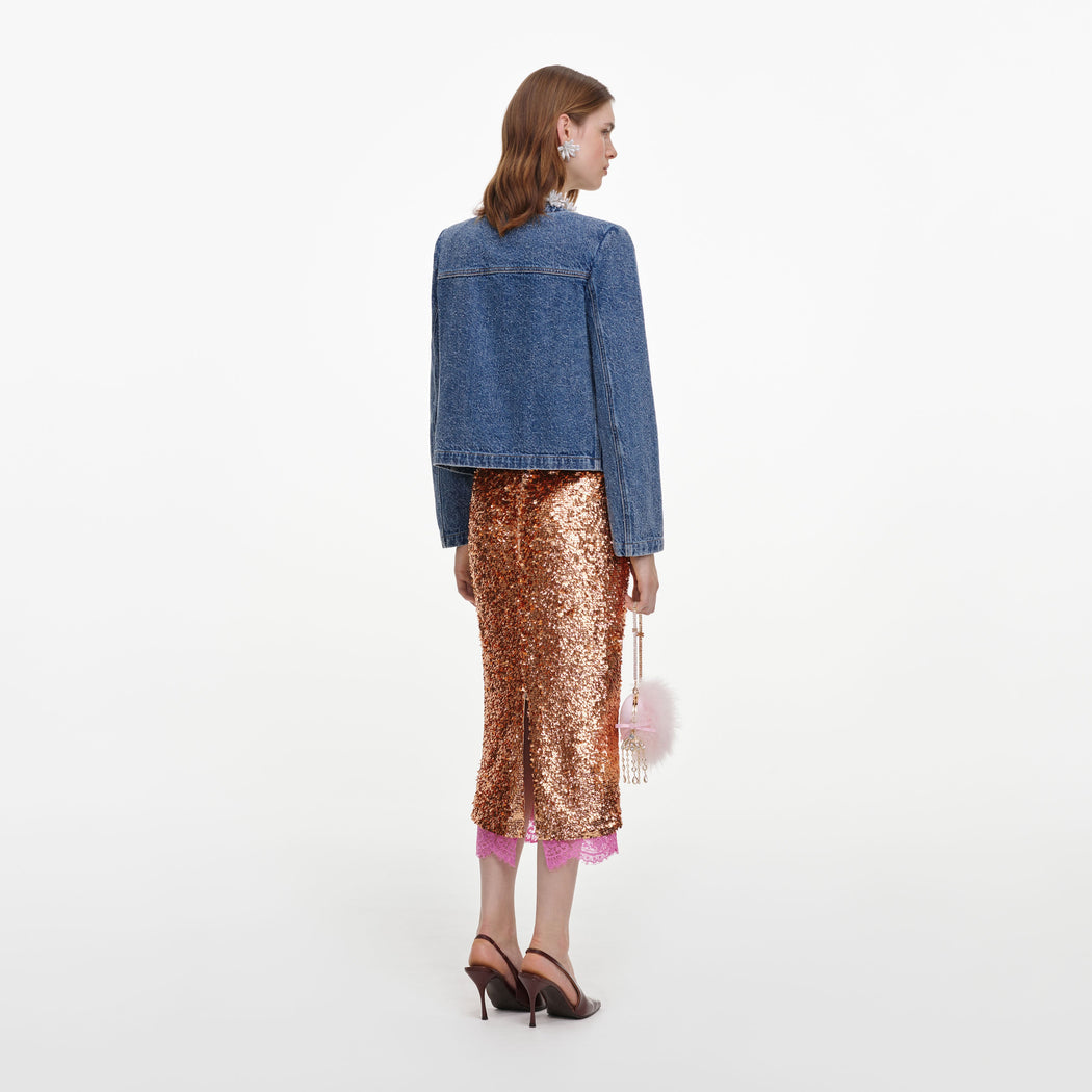 Back view of a woman wearing the Textured Denim Jacket
