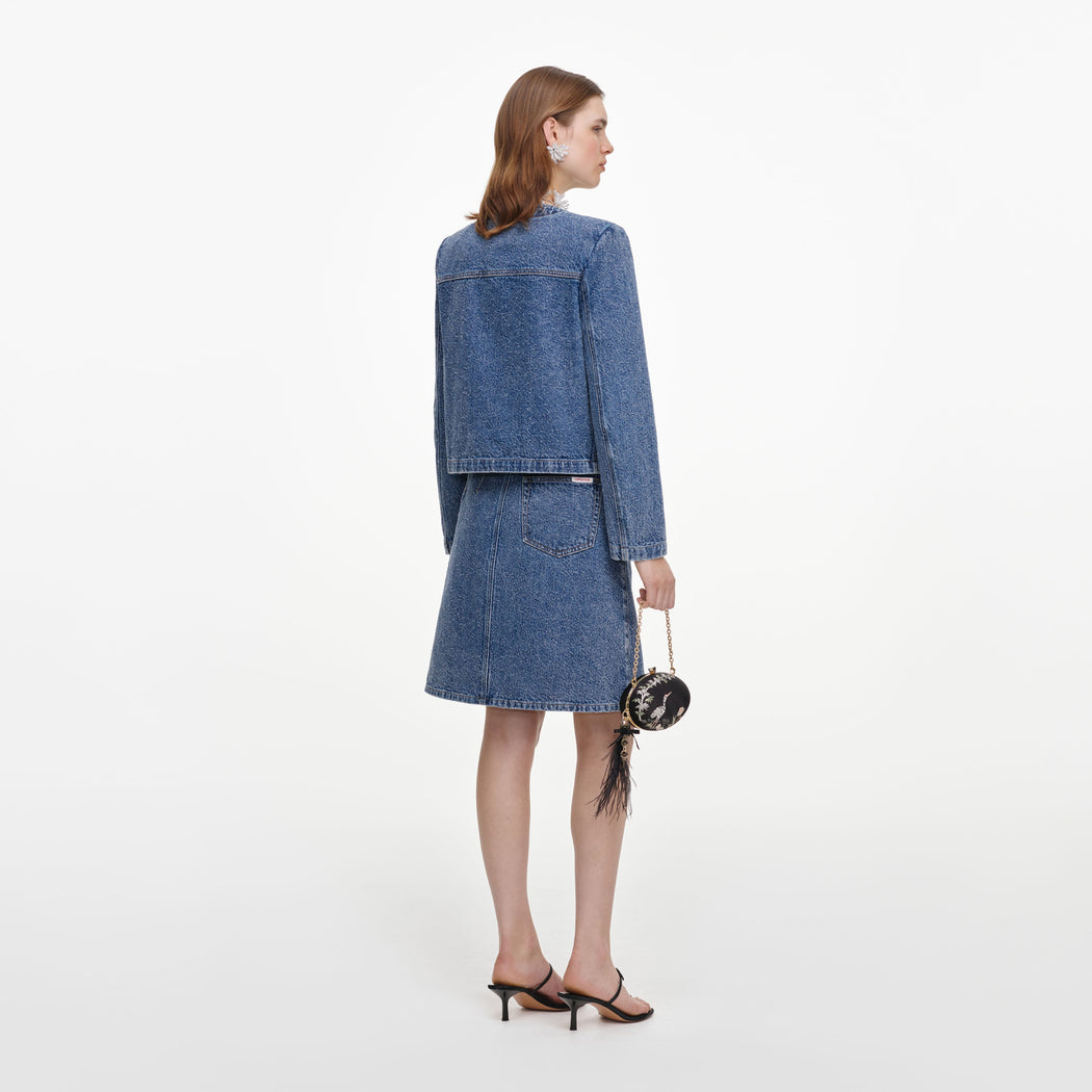 Back view of a woman wearing the Textured Denim Mini Skirt