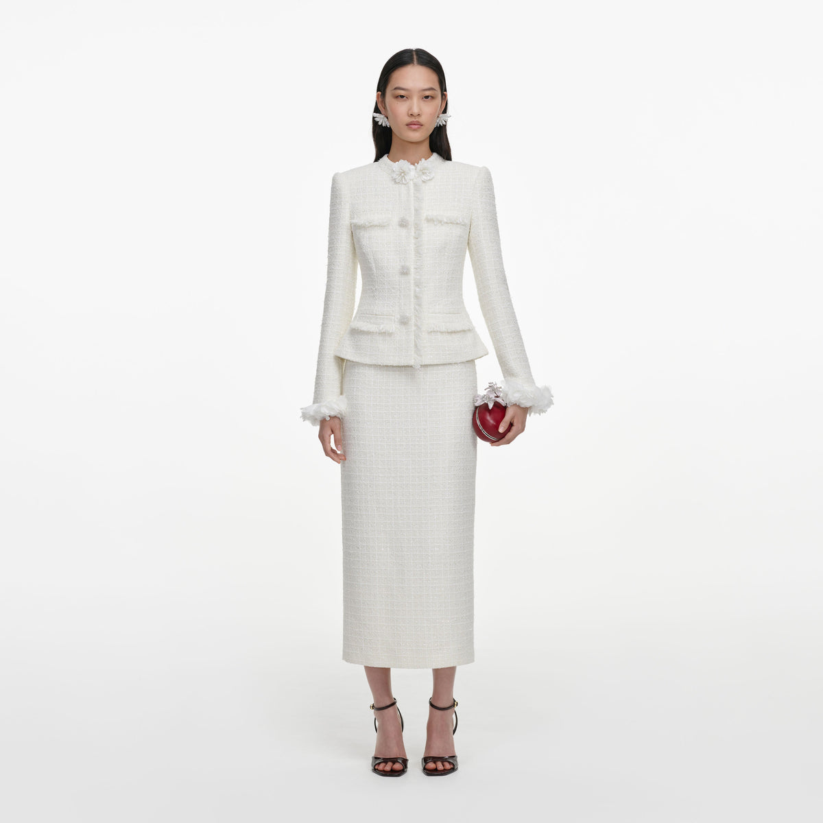 Front view of a woman wearing the Cream Boucle Flower Midi Dress