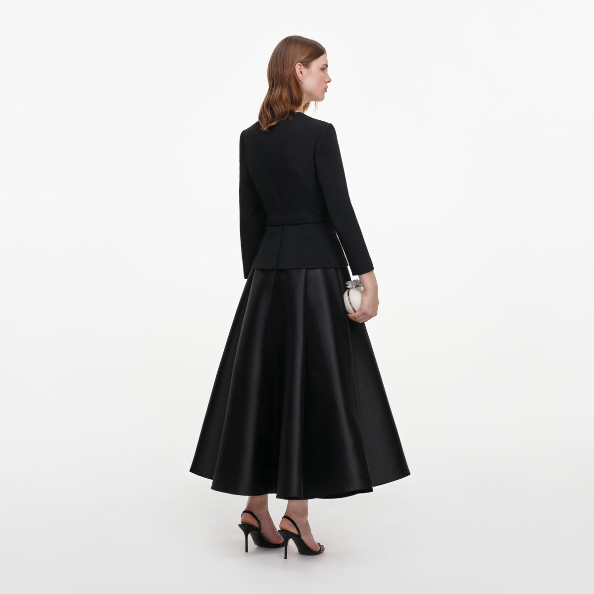 Back view of a woman wearing the Black Taffeta Brooch Midi Dress