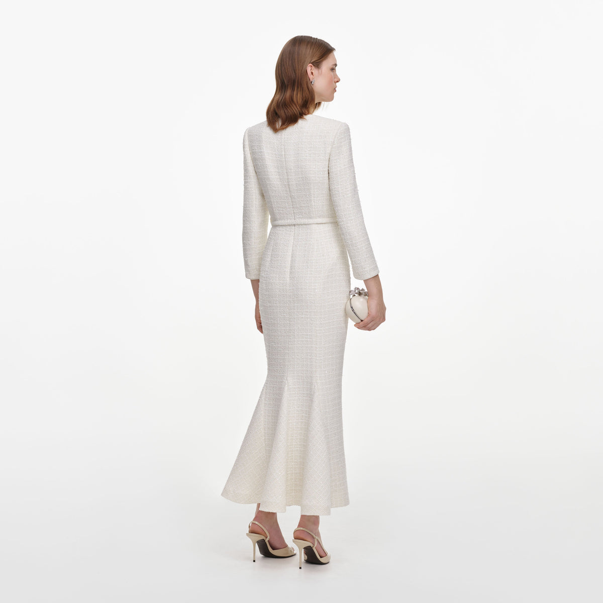 Back view of a woman wearing the Cream Tailored Boucle Brooch Midi Dress