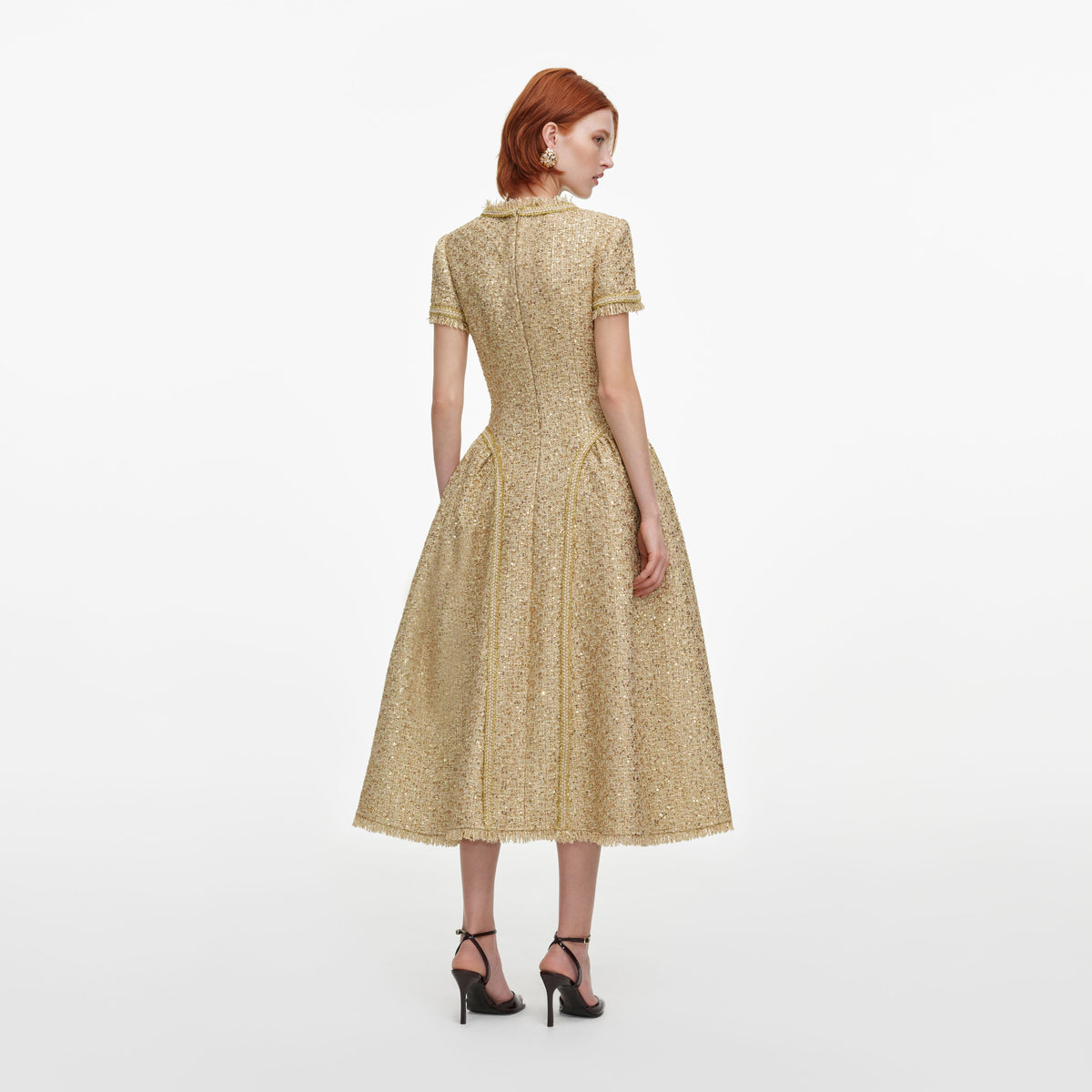 Back view of a woman wearing the Gold Sequin Boucle Midi Dress