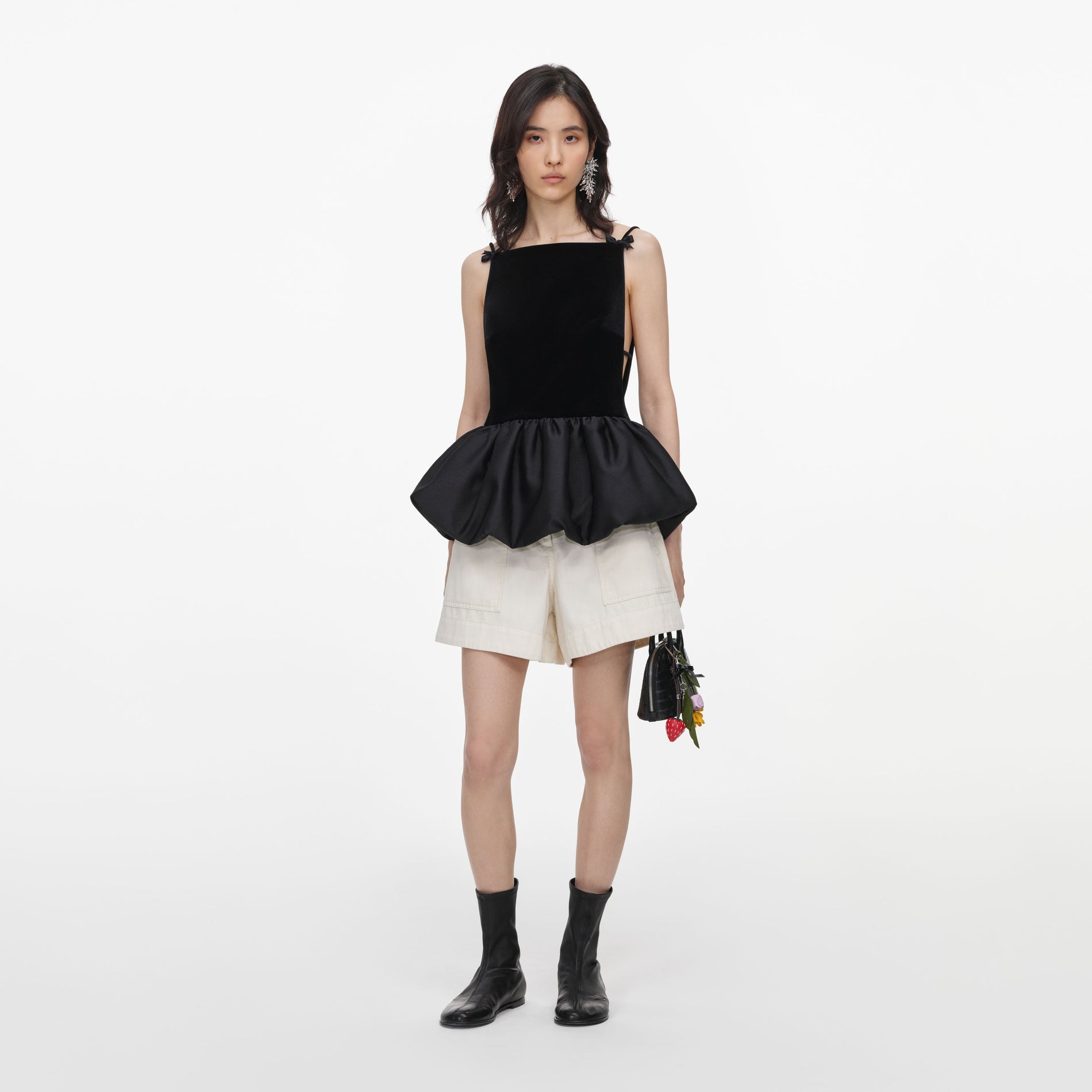 Front view of a woman wearing the Black Velvet Bubble Hem Top