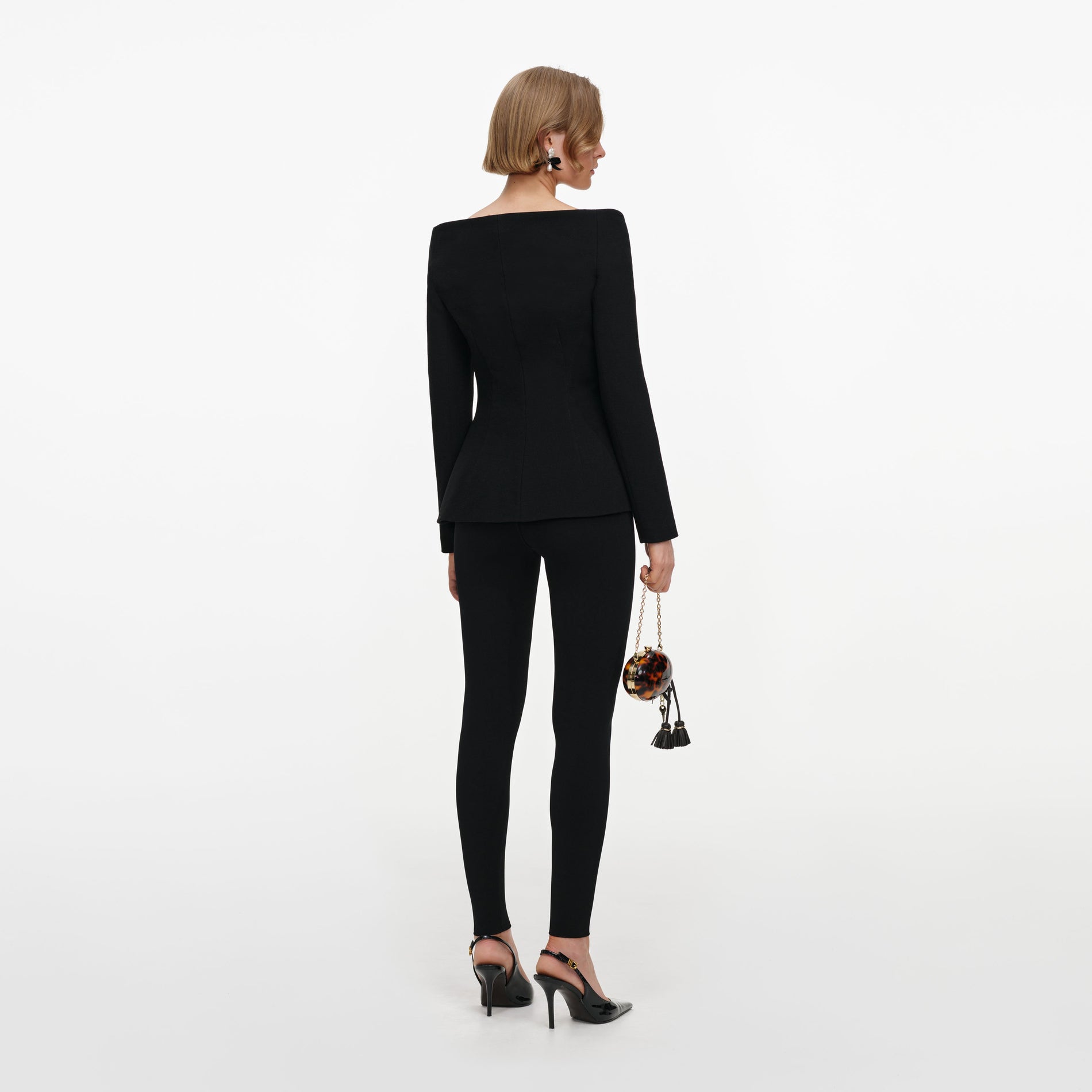 Back view of a woman wearing the Black Wool Crepe Jacket