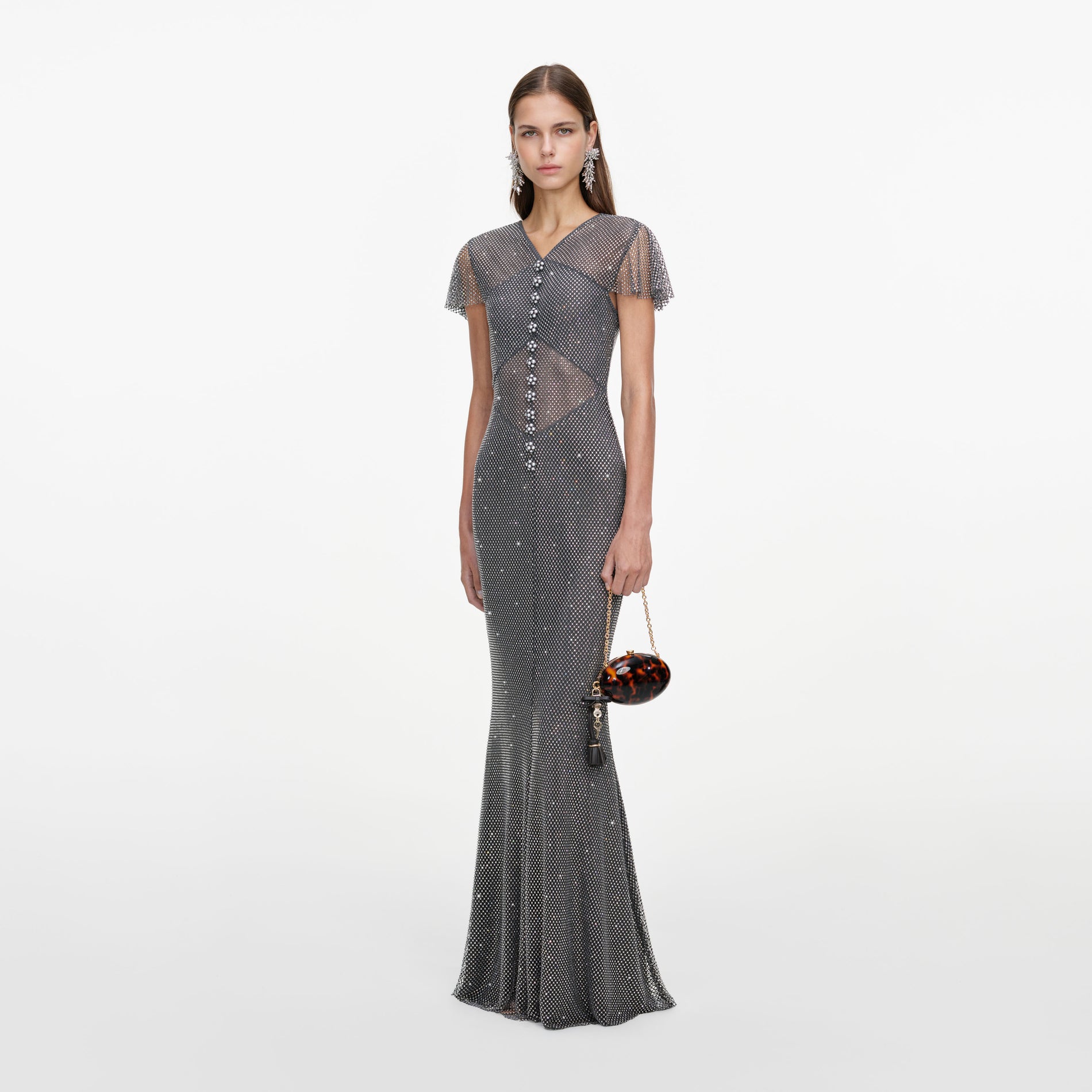 Side view of a woman wearing the Grey Rhinestone Fishnet Maxi Dress