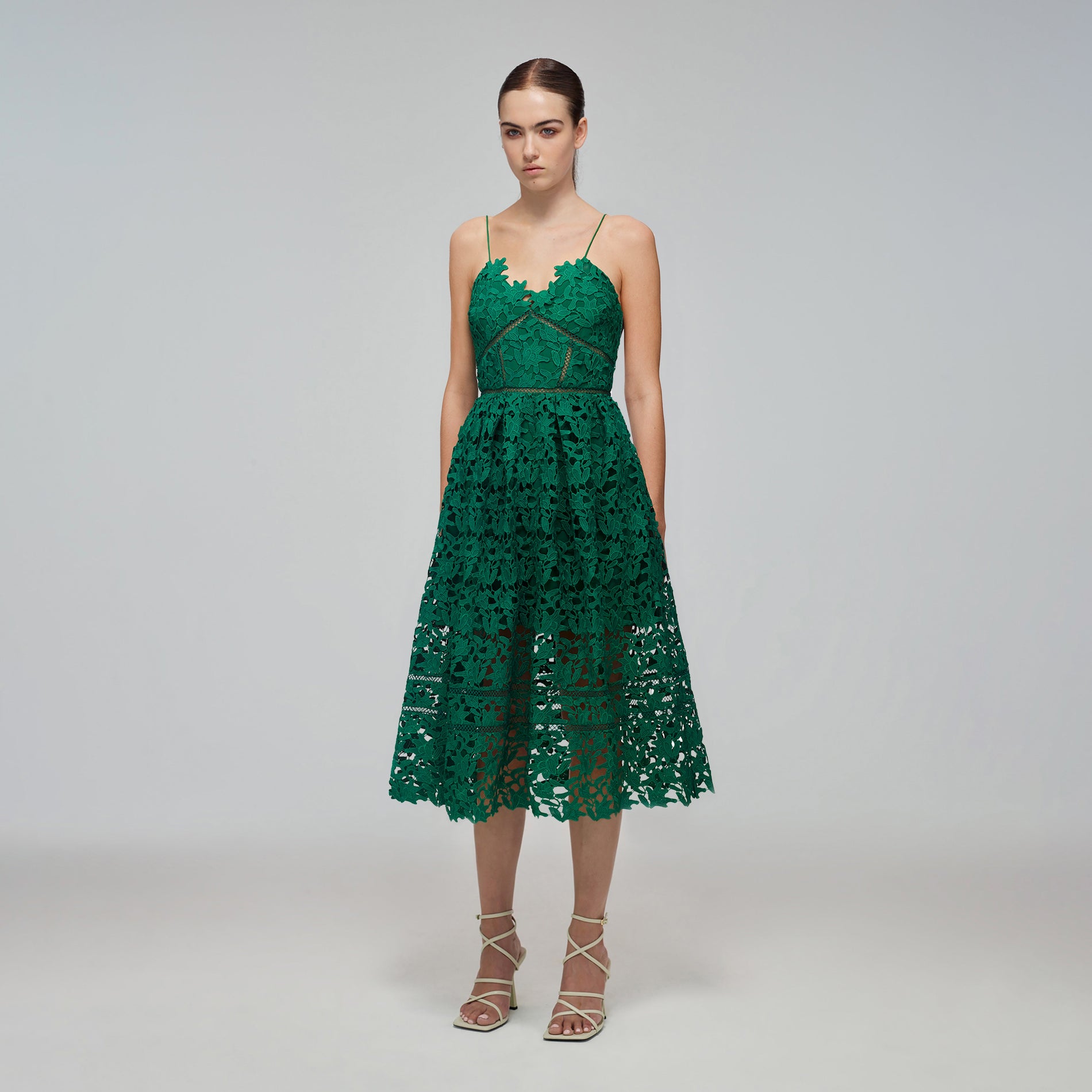 A woman wearing the Green Azaelea Midi Dress