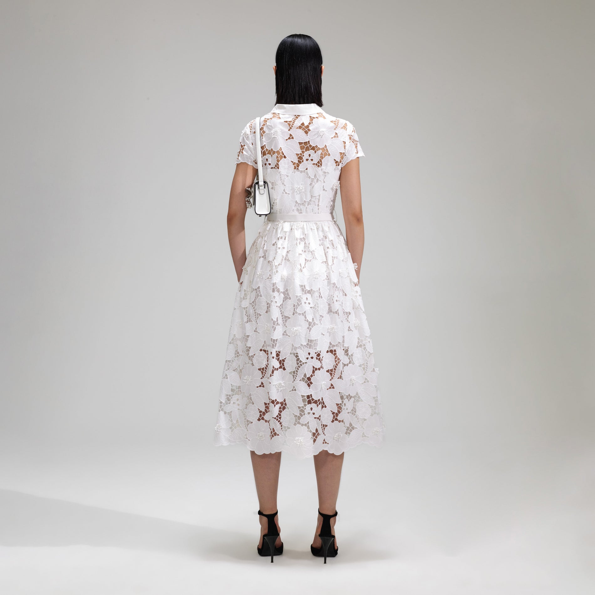 A woman wearing the White 3D Cotton Lace Collar Midi Dress