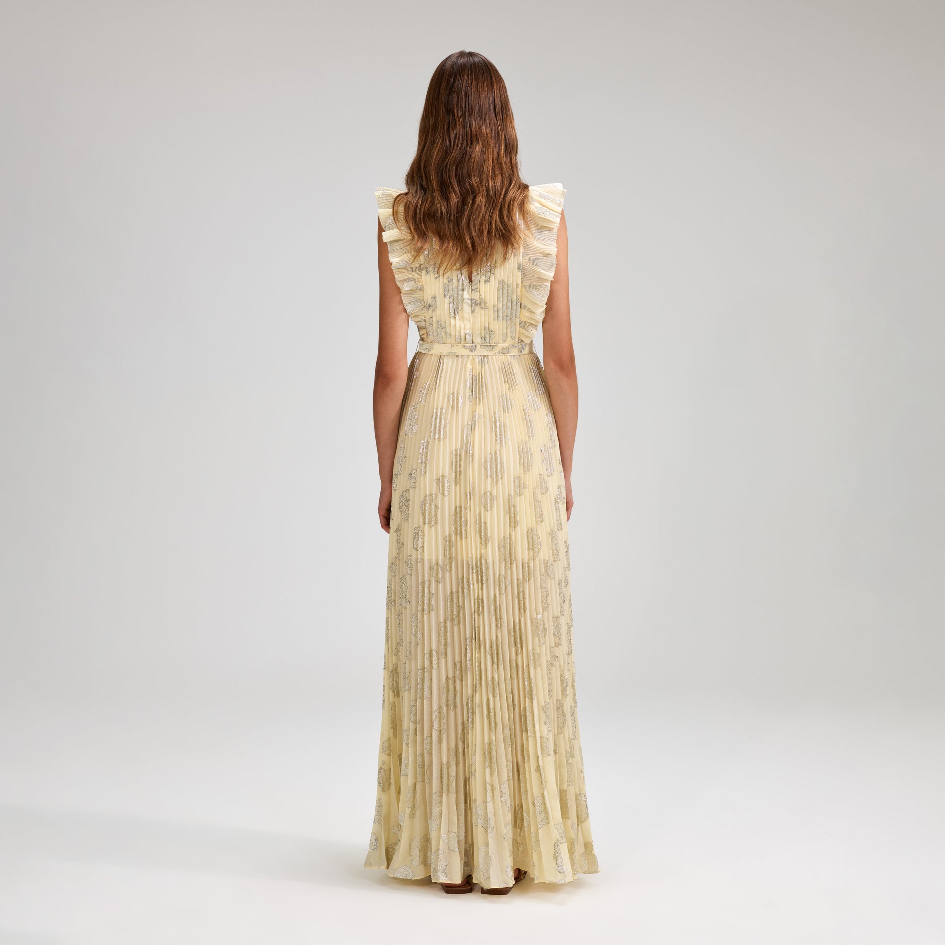 A woman wearing the Metallic Jacquard Maxi Dress