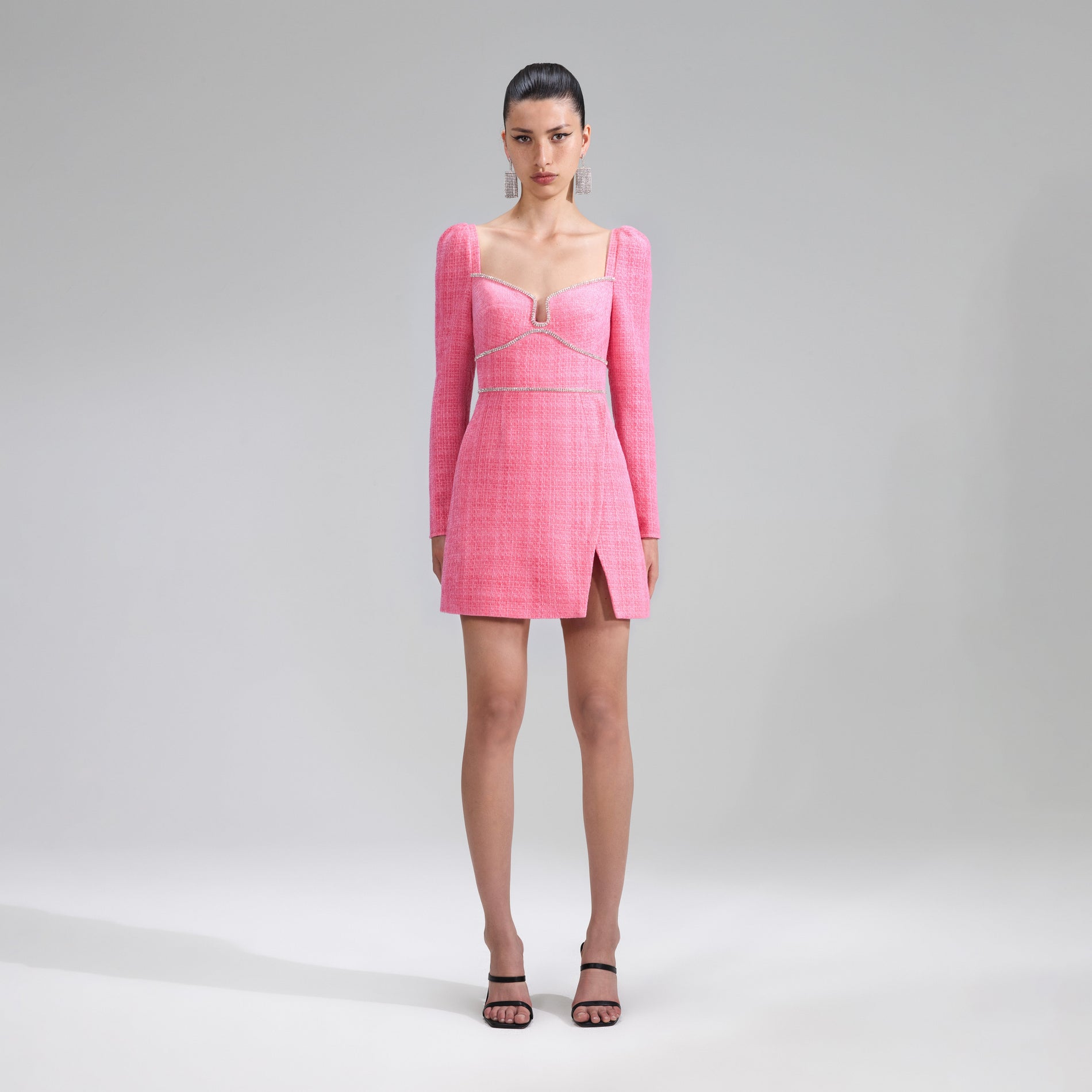 A woman wearing the Pink Boucle Diamante Detail Mini Dress