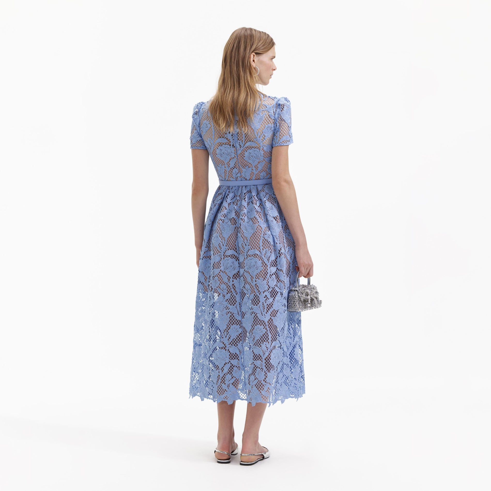 A Woman wearing the Blue Lily Lace Midi Dress