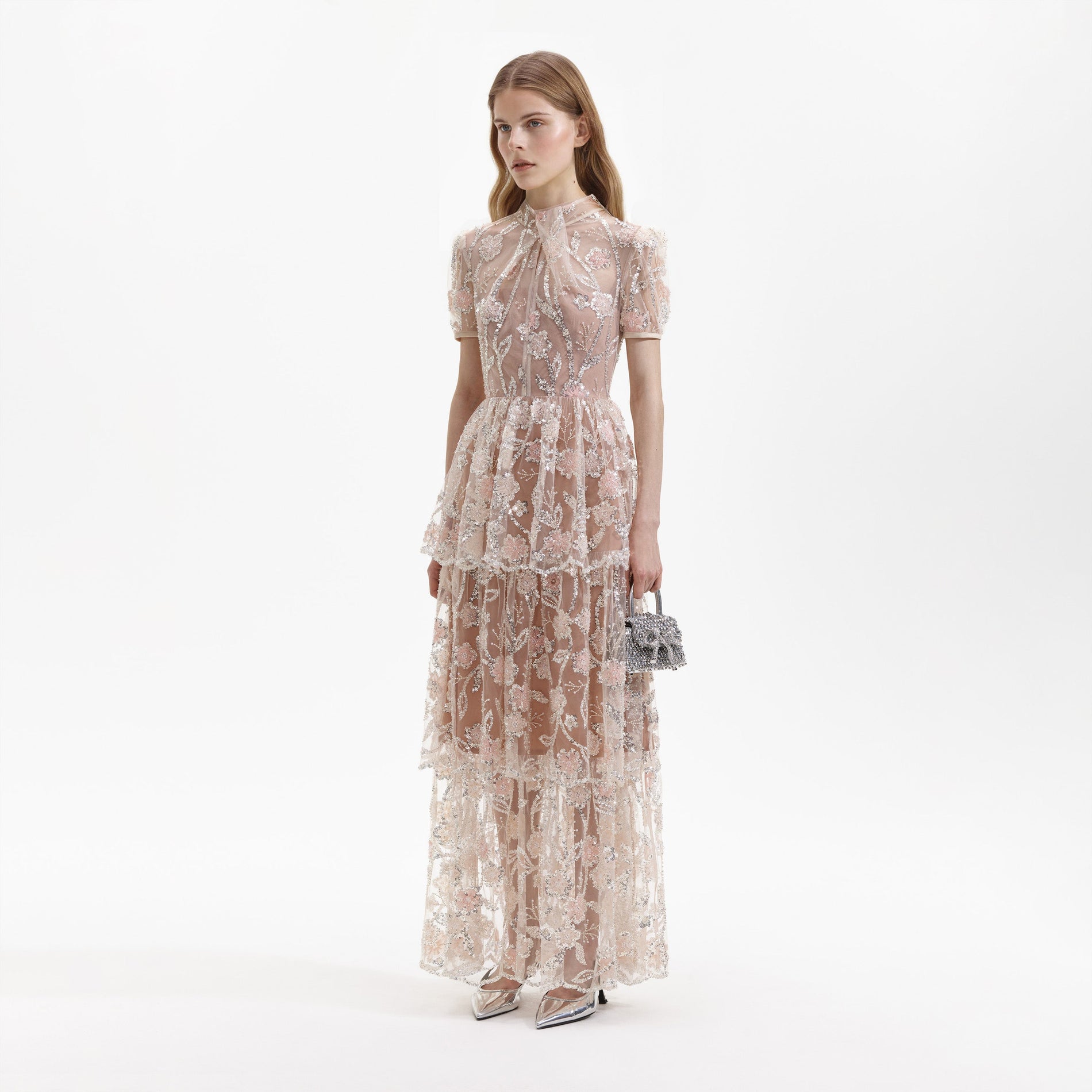 Side view of a woman wearing the Sequin Flower Maxi Dress