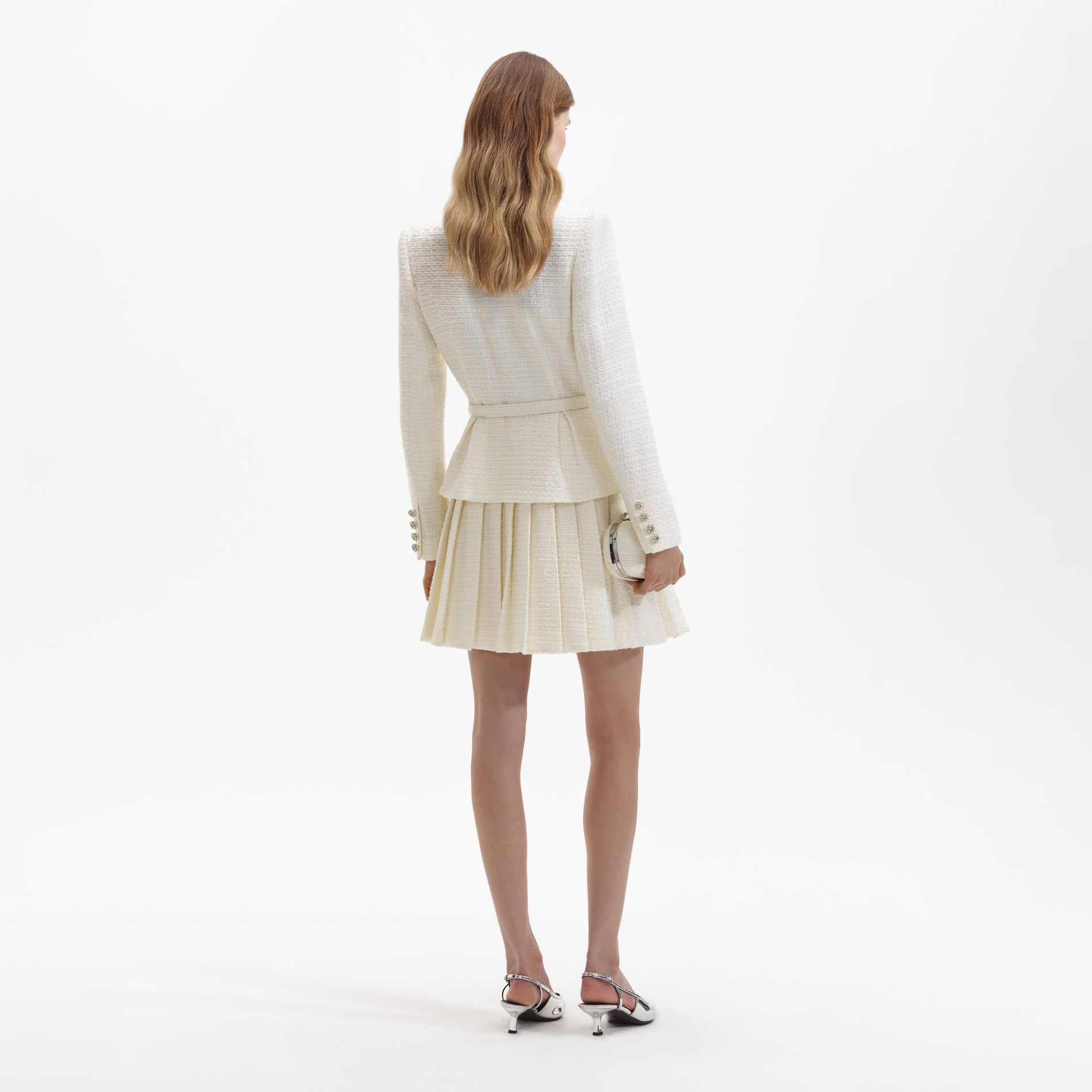 Back view of a woman wearing the Cream Boucle Mini Jacket Dress