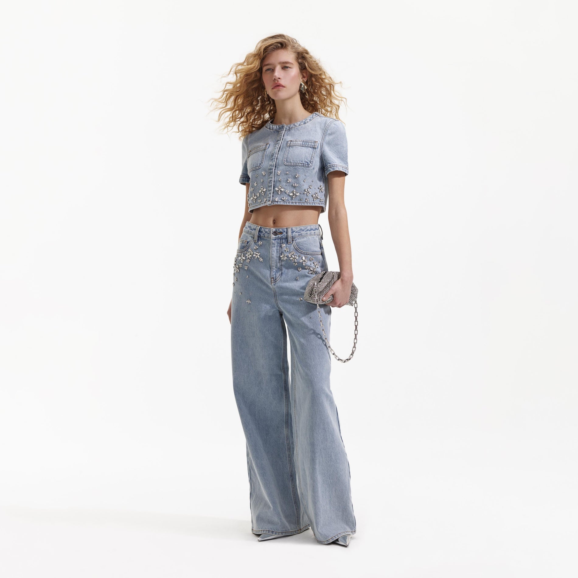 Side view of a woman wearing the Blue Embellished Jeans