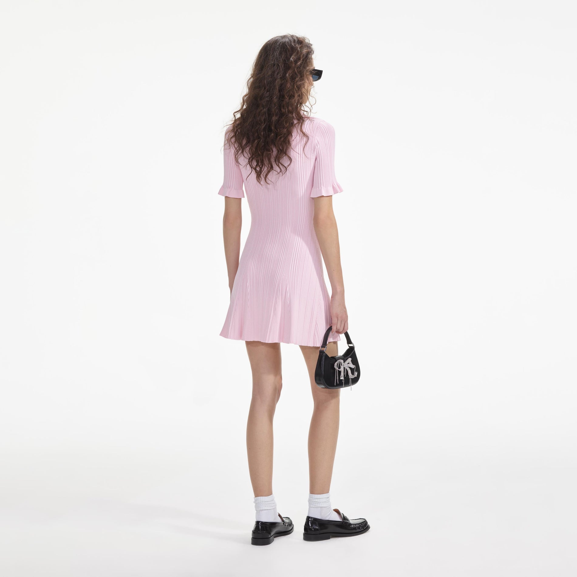 Back view of a woman wearing the Pink Viscose Knit Mini Dress