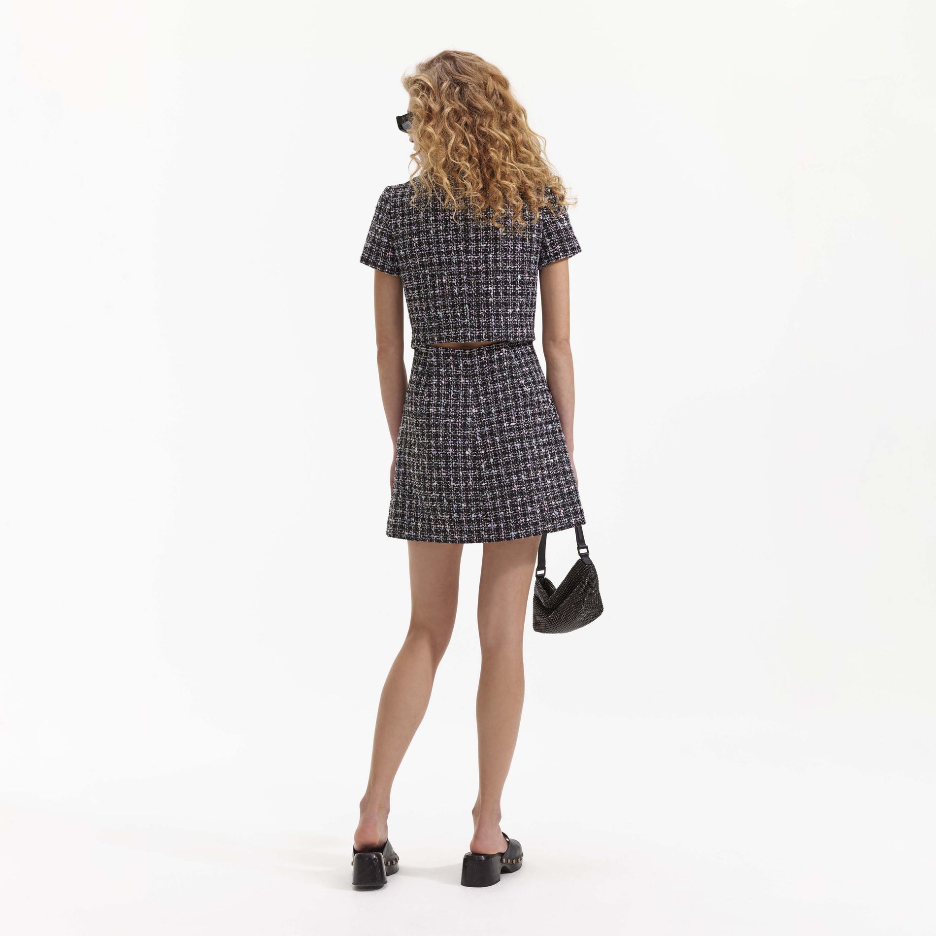 Back view of a woman wearing the Black Checked Boucle Mini Dress