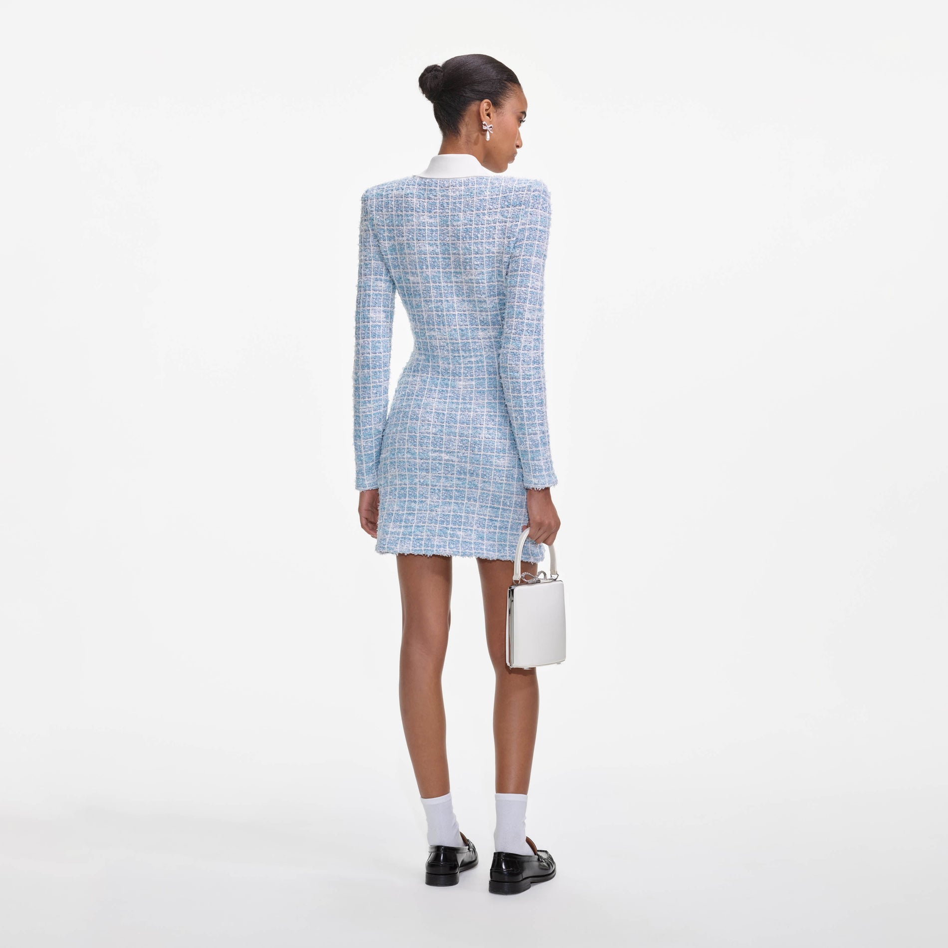 Back view of a woman wearing the Blue Check Collared Knit Mini Dress