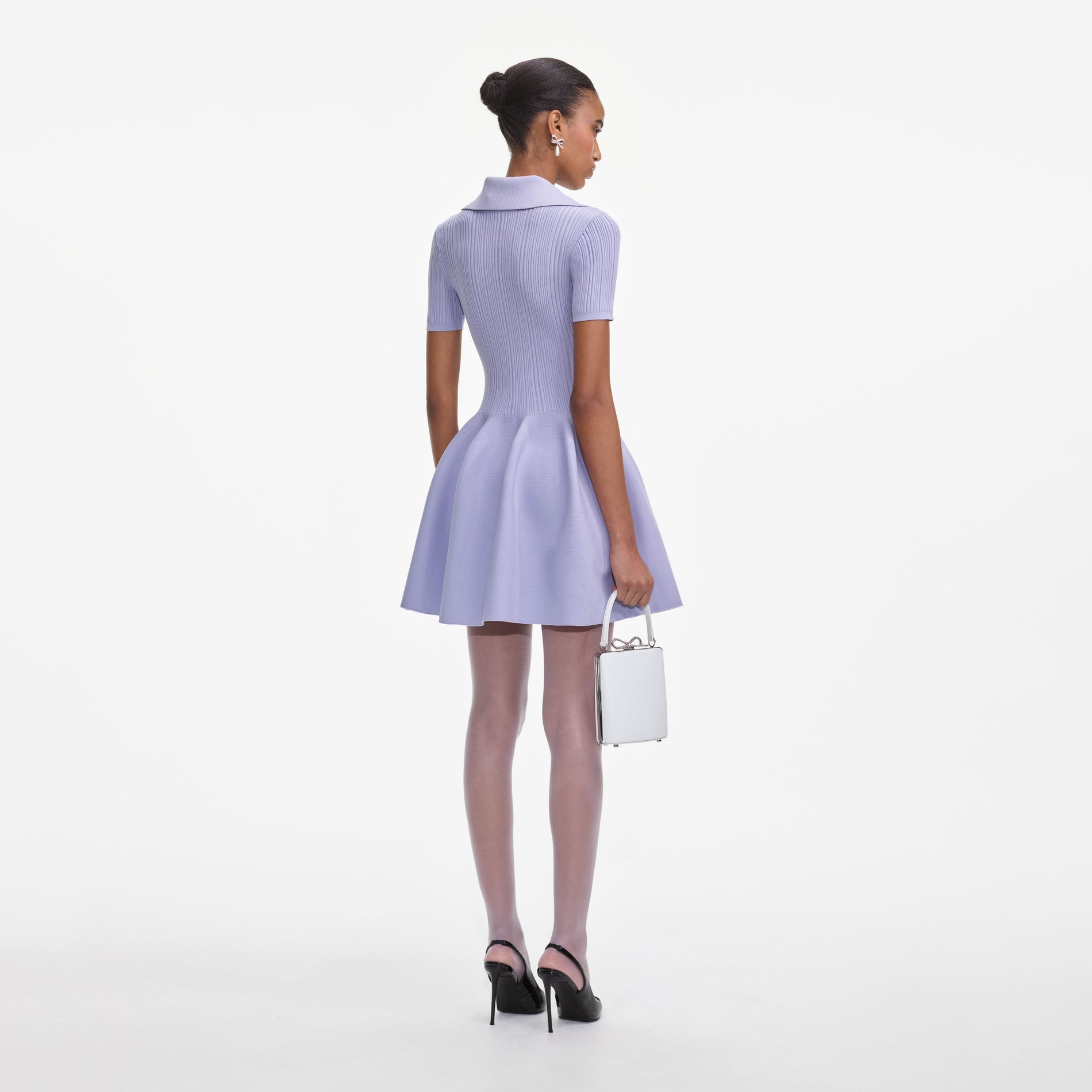 Back view of a woman wearing the Lilac Ribbed Knit Mini Dress