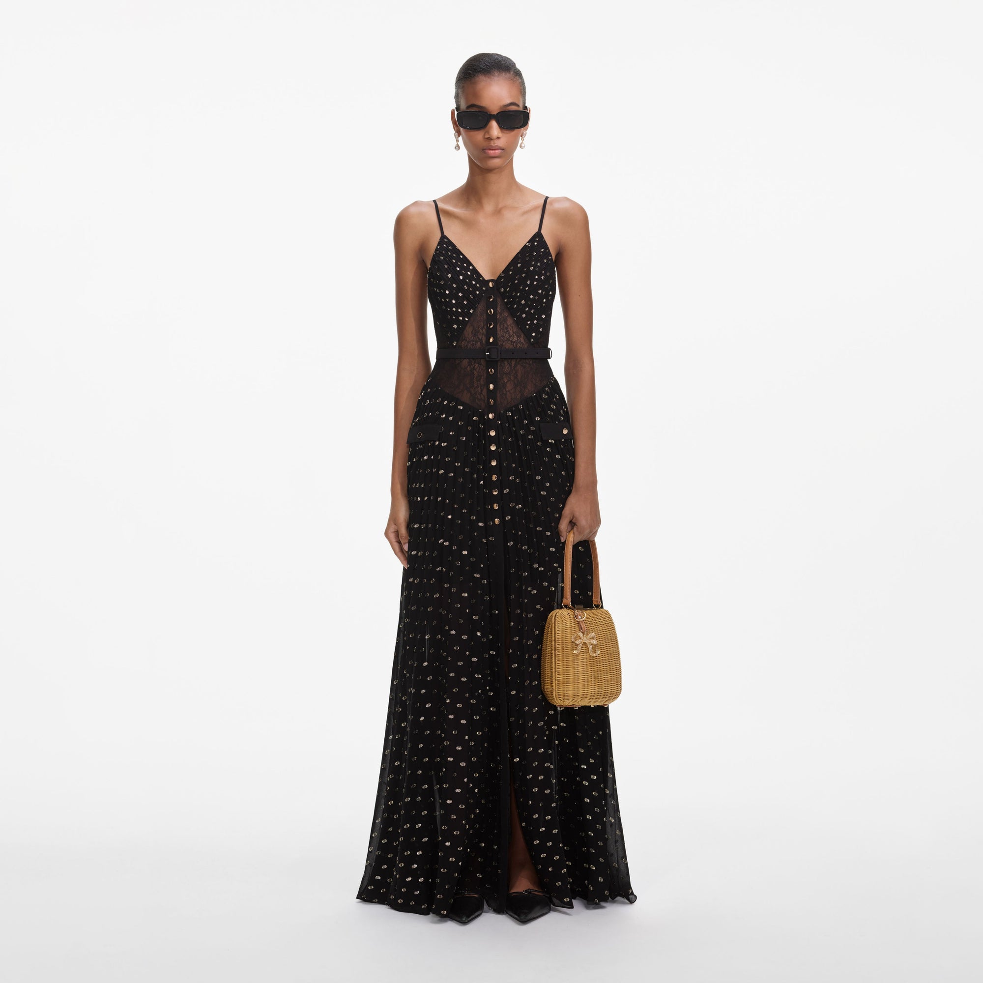 Front view of a woman wearing the Black And Gold Chiffon Maxi Dress