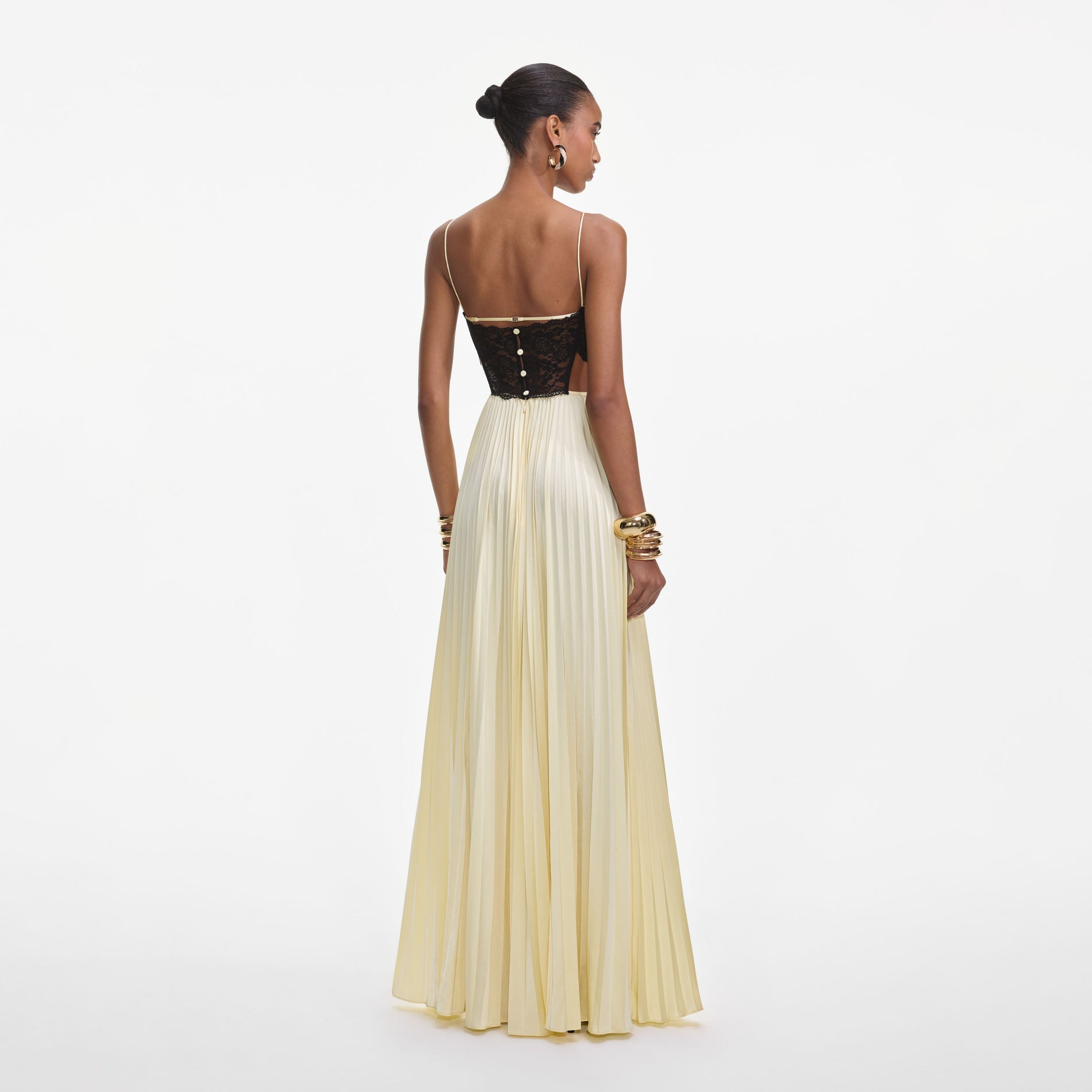 Back view of a woman wearing the Yellow Satin Lace Maxi Dress