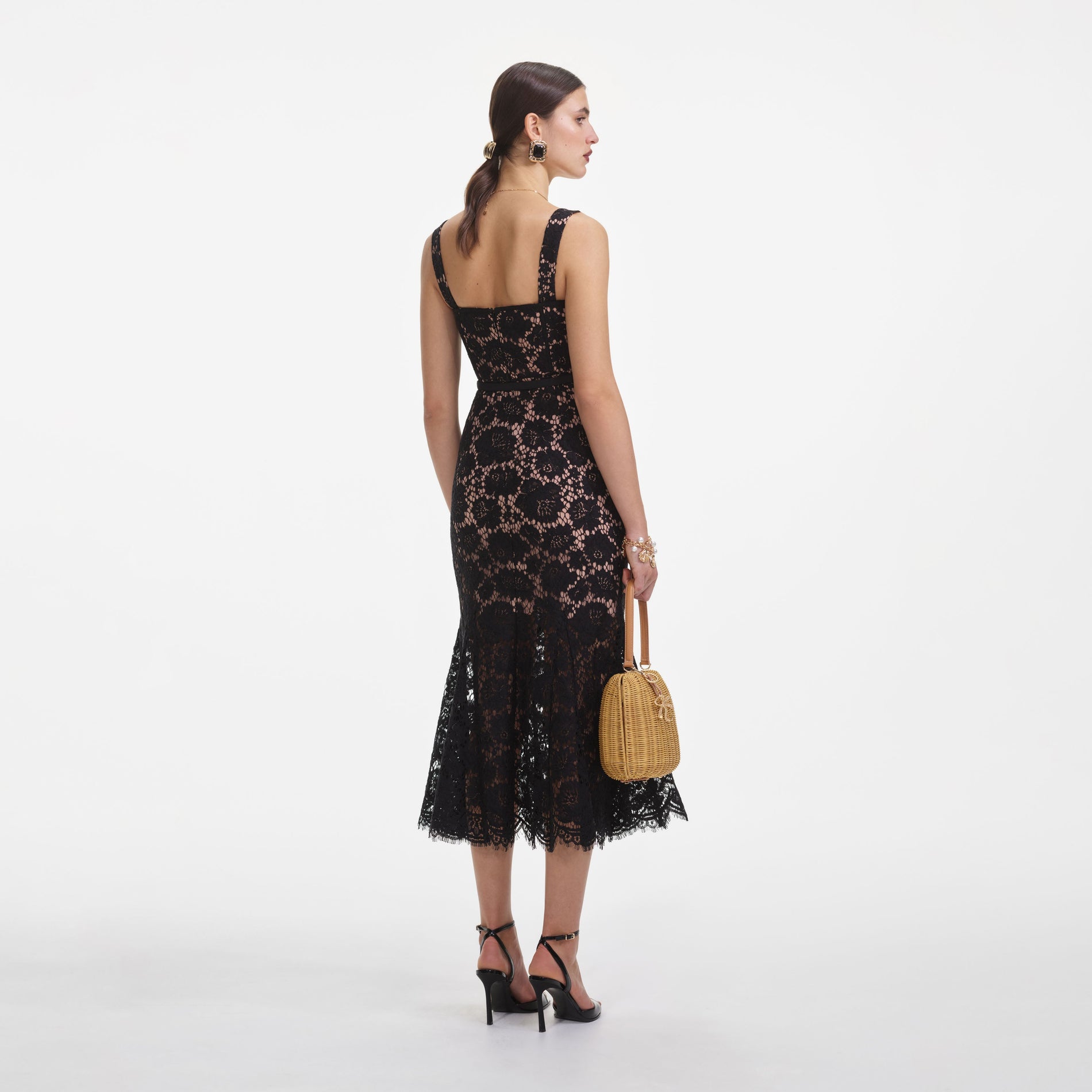 Back view of a woman wearing the Black Fine Lace Midi Dress