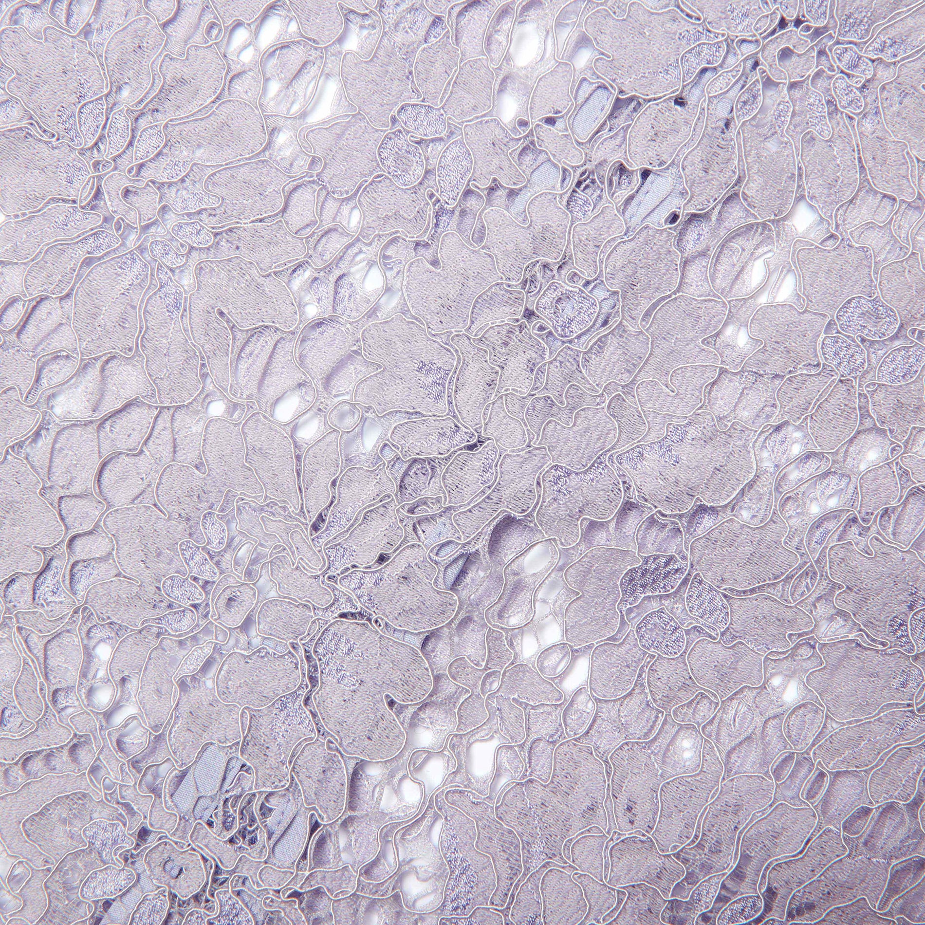 Side view of a woman wearing the Lilac Lace Fluted Sleeve Top