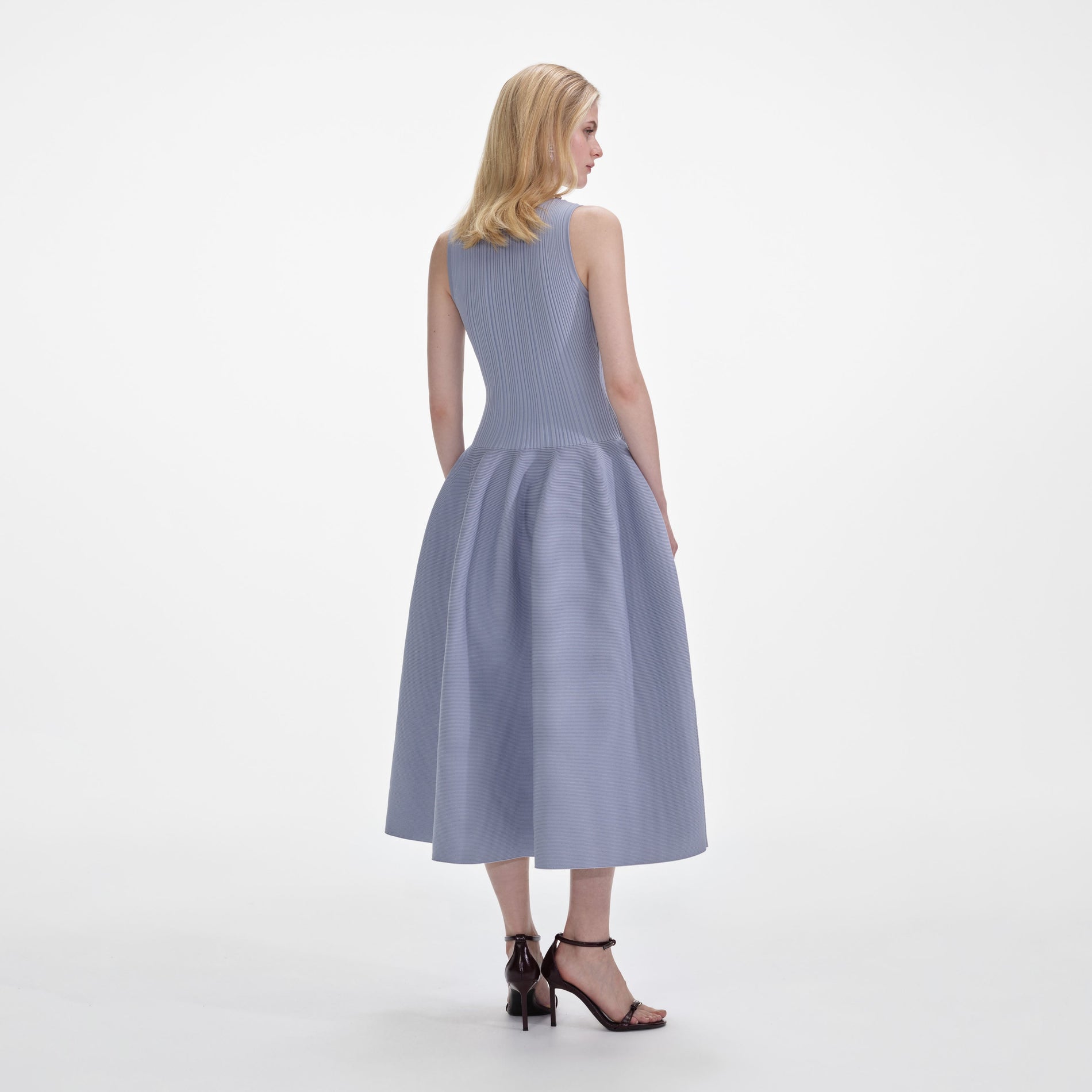 Back view of a woman wearing the Blue Ribbed Knit Diamante Midi Dress