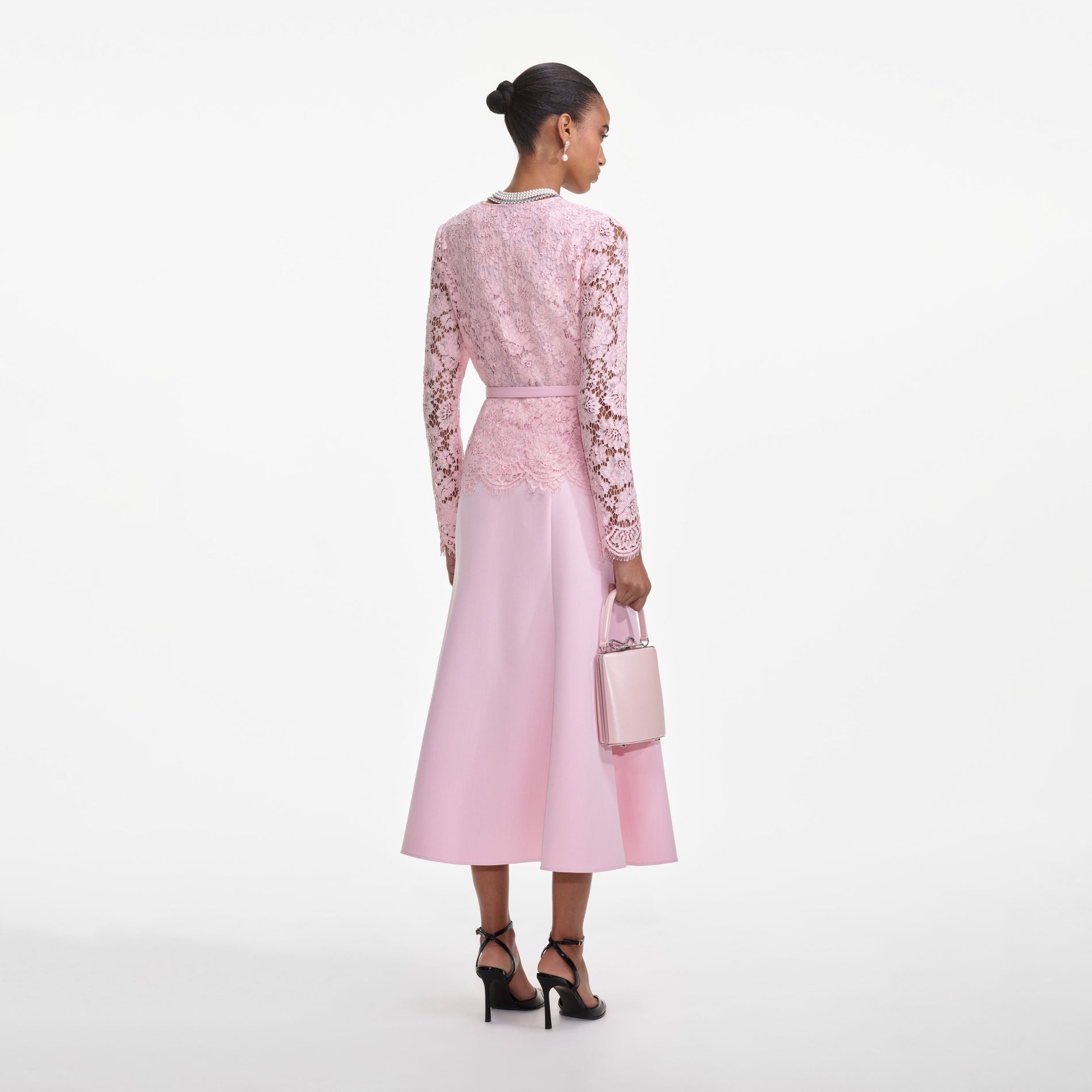 Back view of a woman wearing the Pink Tailored Lace Midi Dress