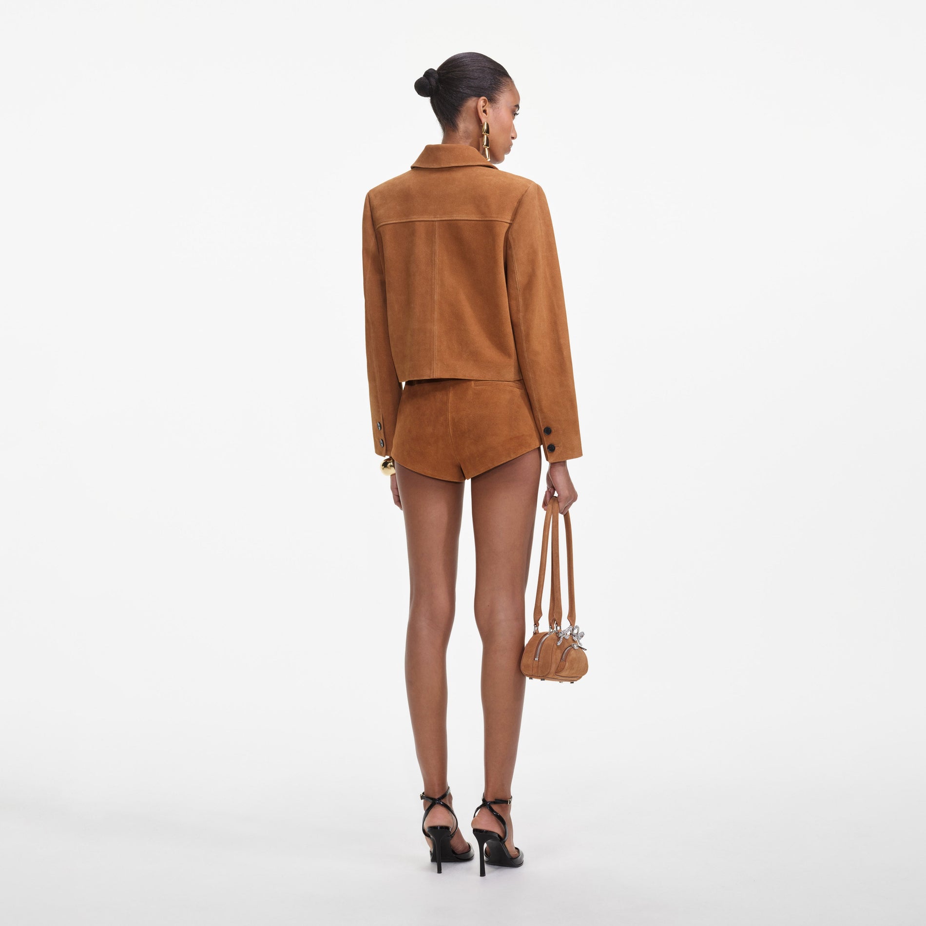 Back view of a woman wearing the Brown Suede Jacket