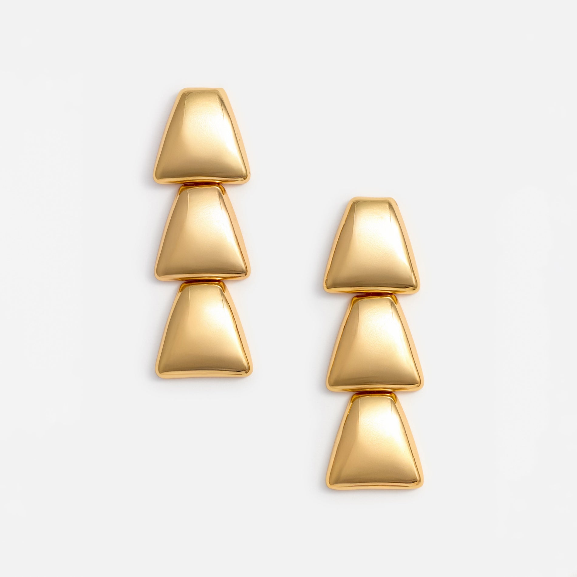 A photo of the Gold Tiered Bell Earrings