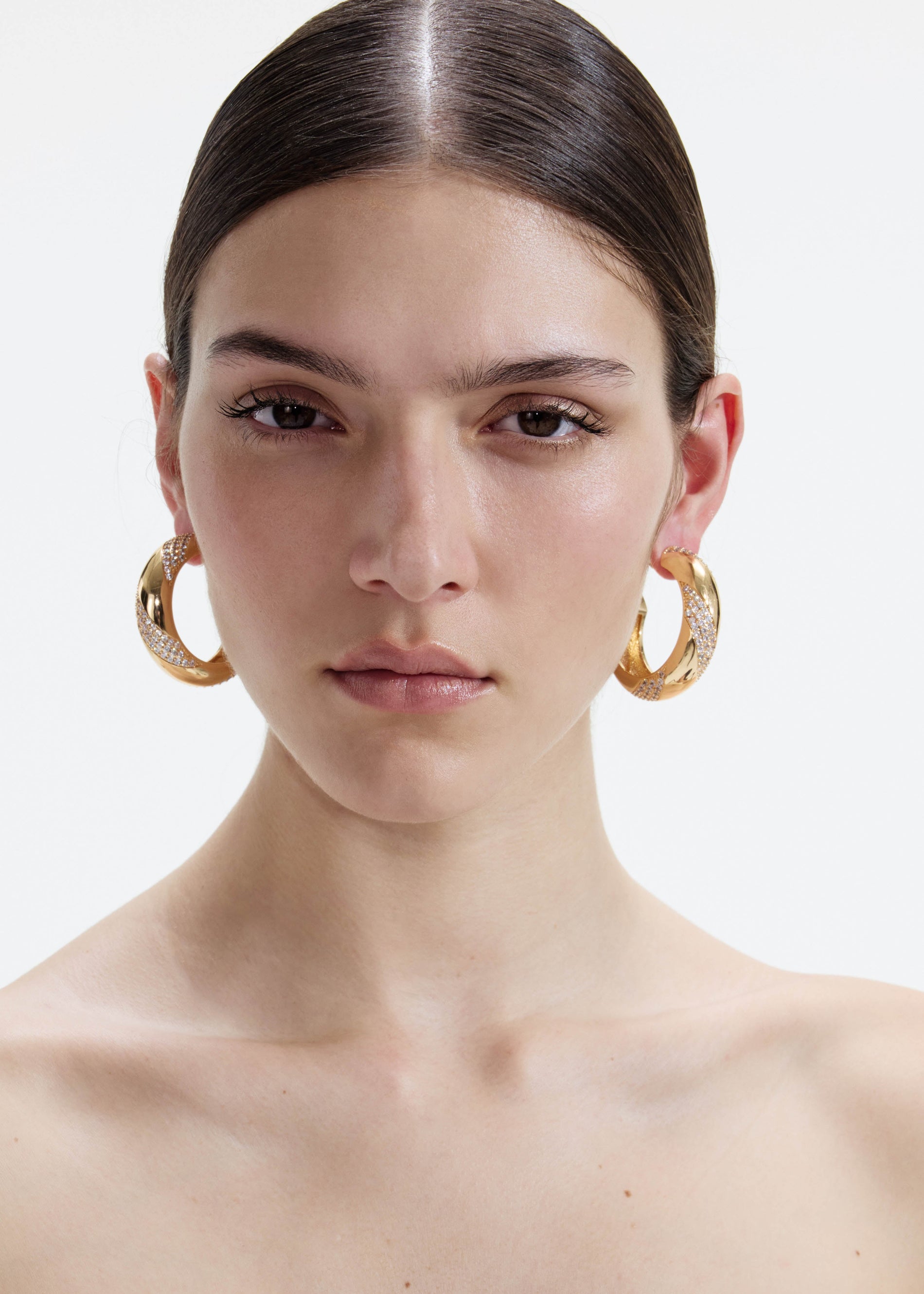 A photo of the Gold And Crystal Hoop Earrings