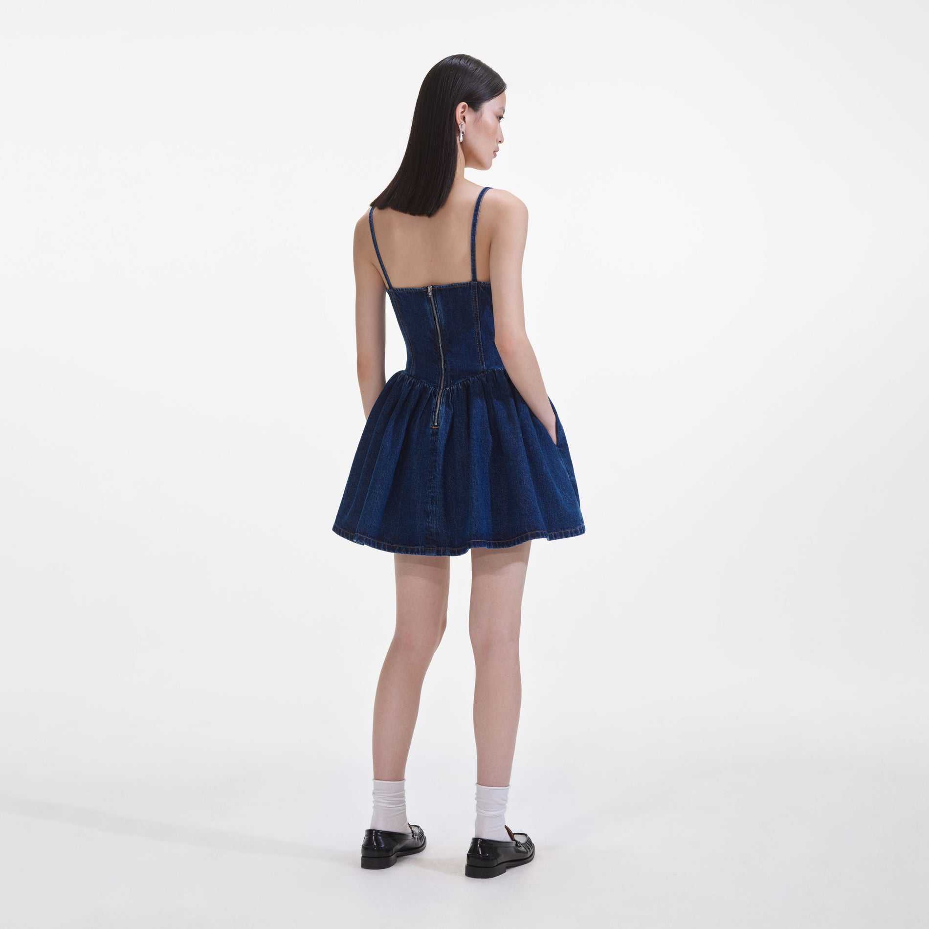 Back view of a woman wearing the Denim Diamante Bow Sweetheart Mini Dress