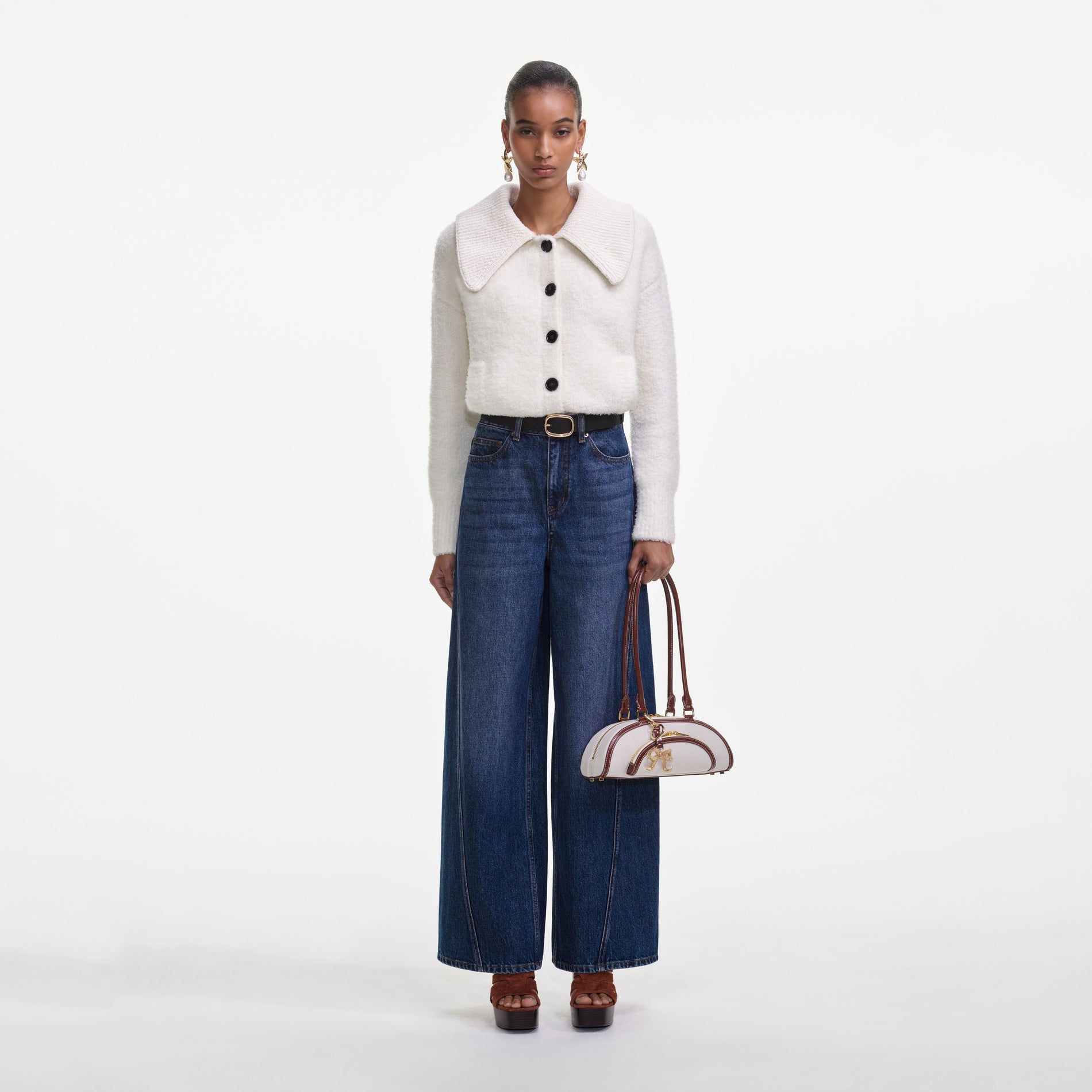 Front view of a woman wearing the Bleached Denim Jeans