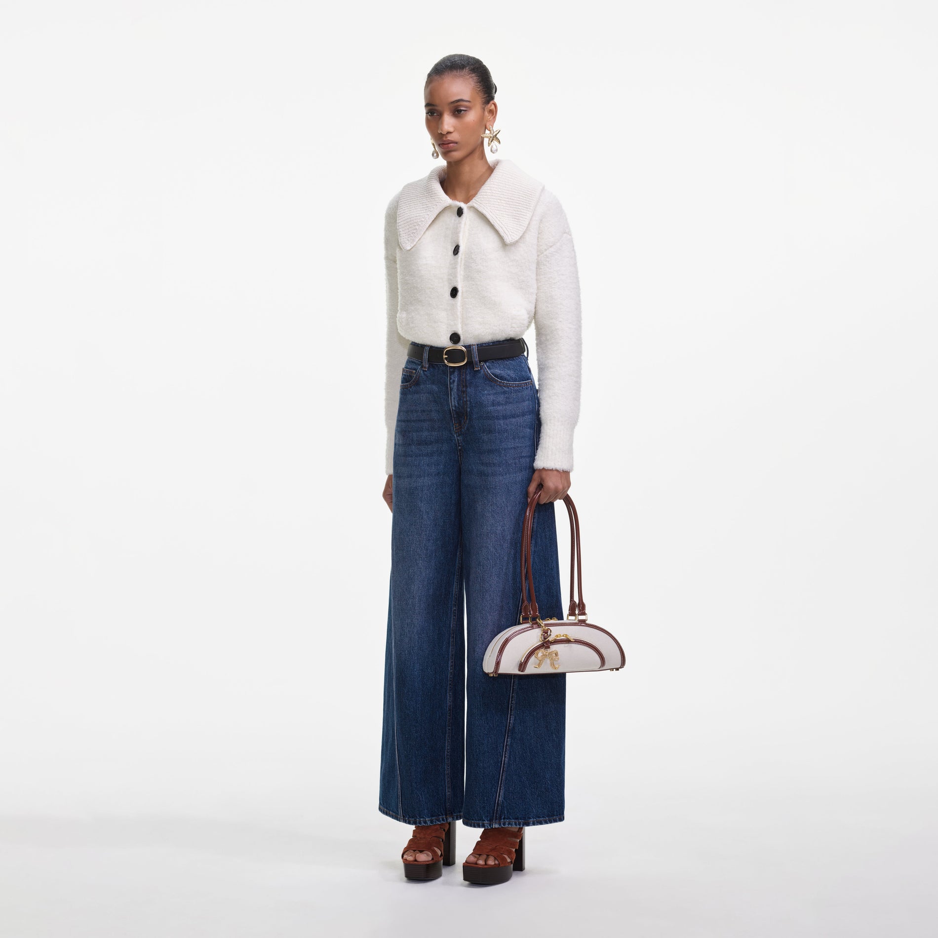 Side view of a woman wearing the Bleached Denim Jeans