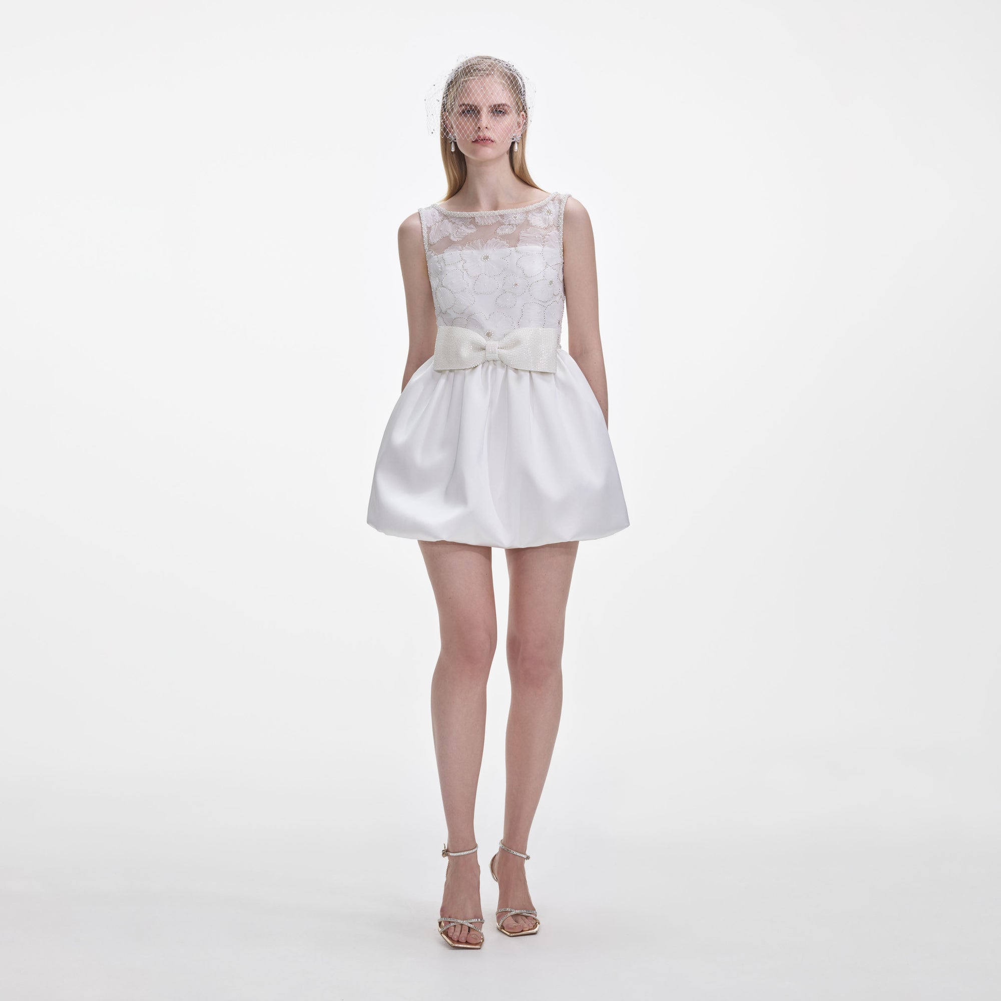 Front view of a woman wearing the White Tulle Mini Dress