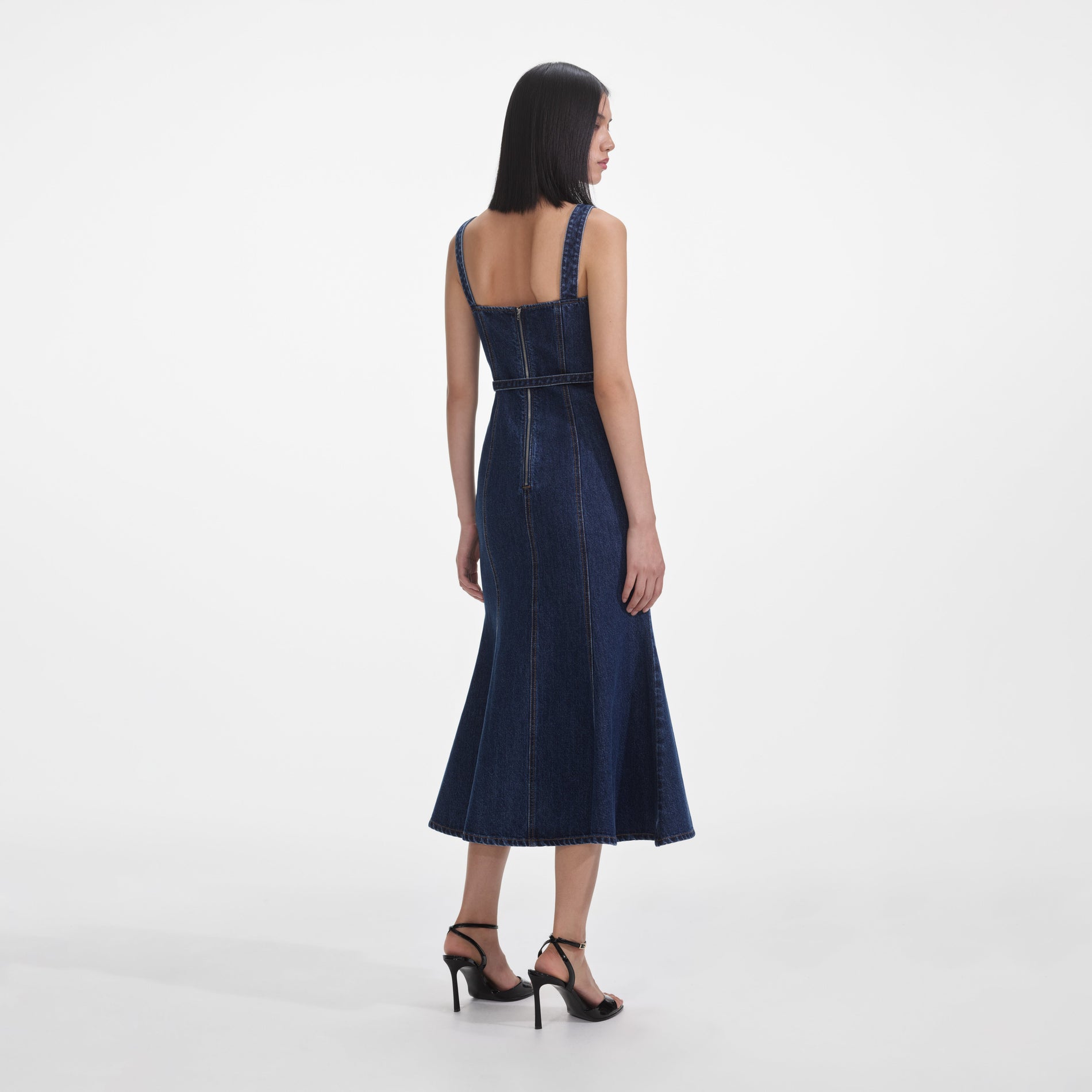 Back view of a woman wearing the Denim Sweetheart Midi Dress