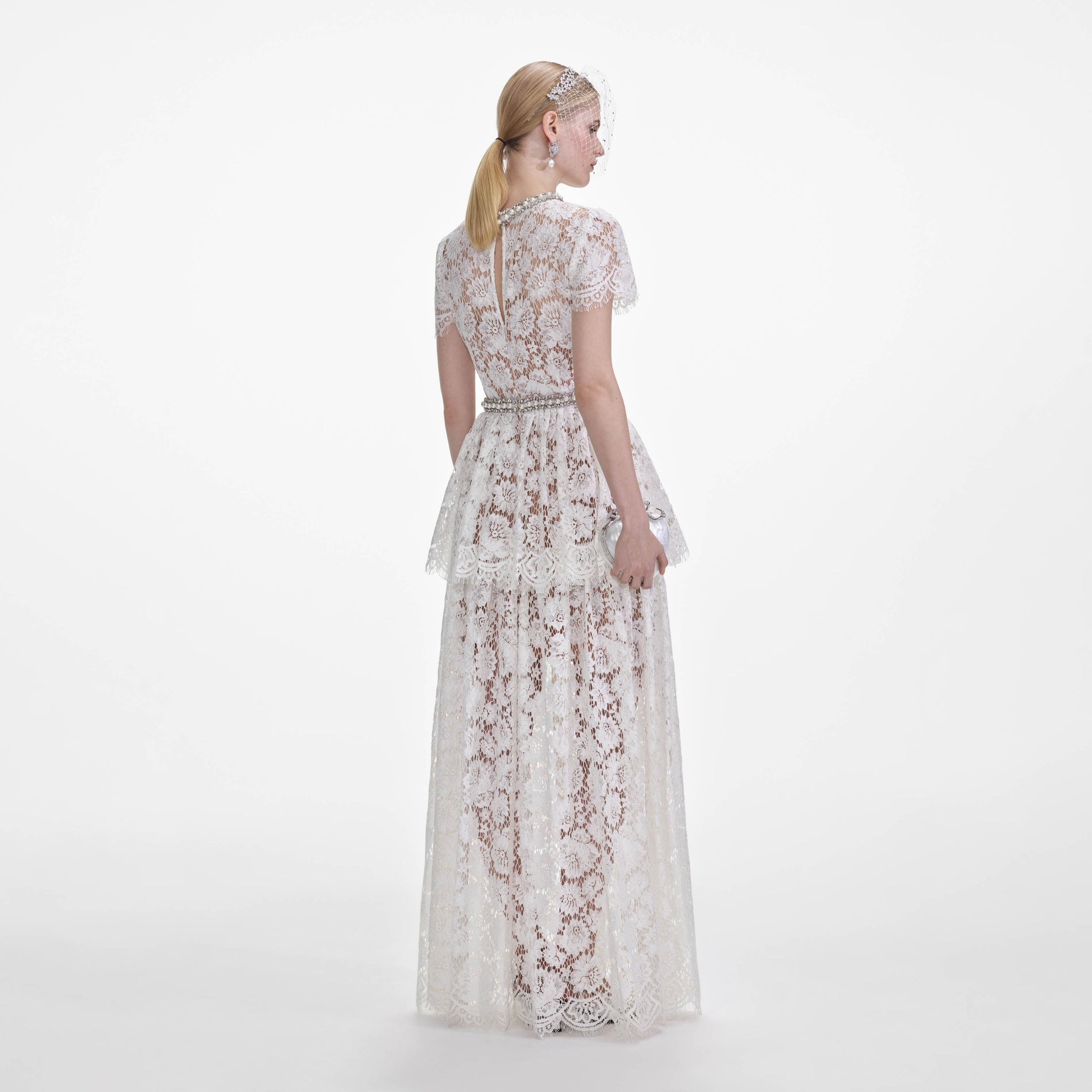 Back view of a woman wearing the White Lace Tiered Maxi Dress