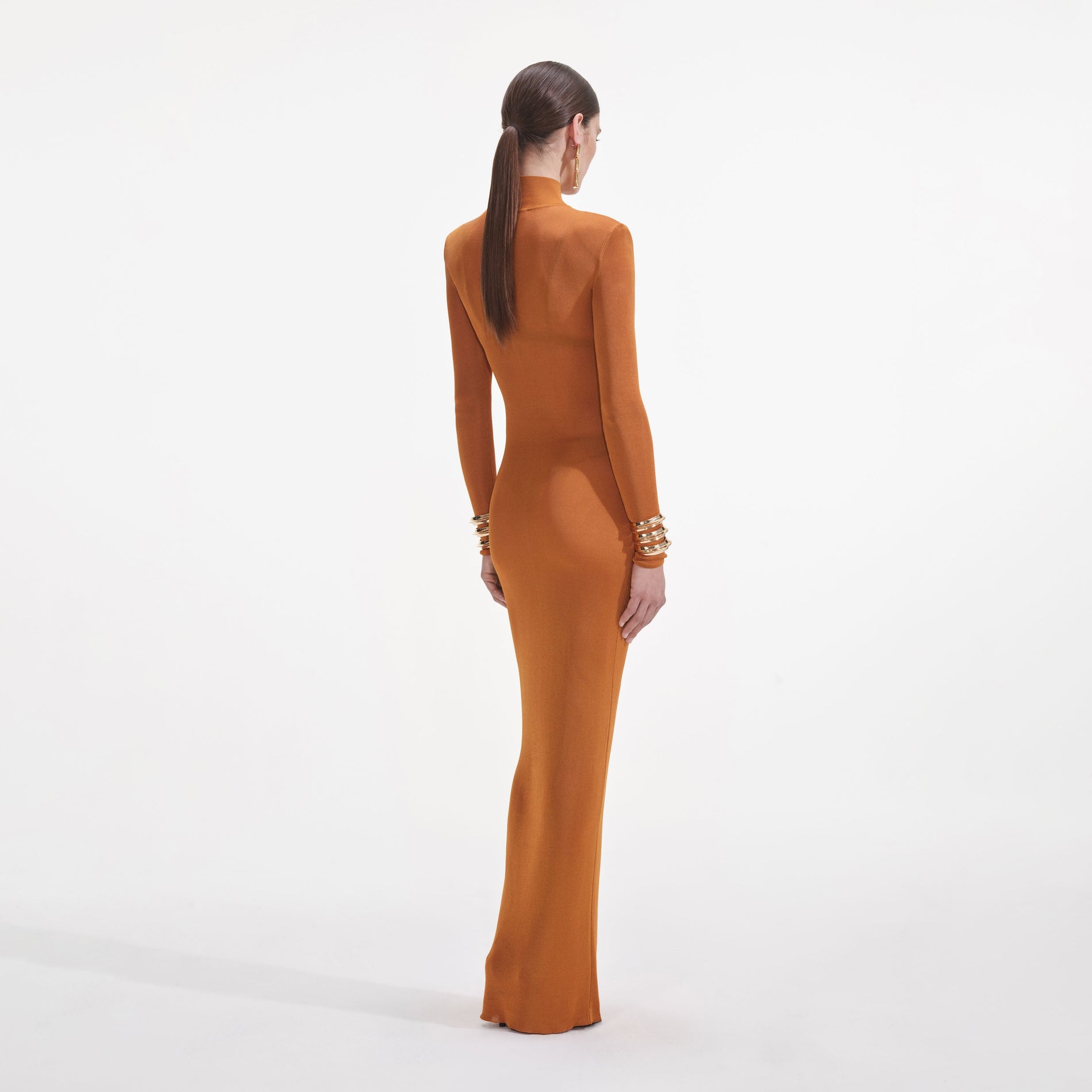 Back view of a woman wearing the Tan Viscose Knit Maxi Dress