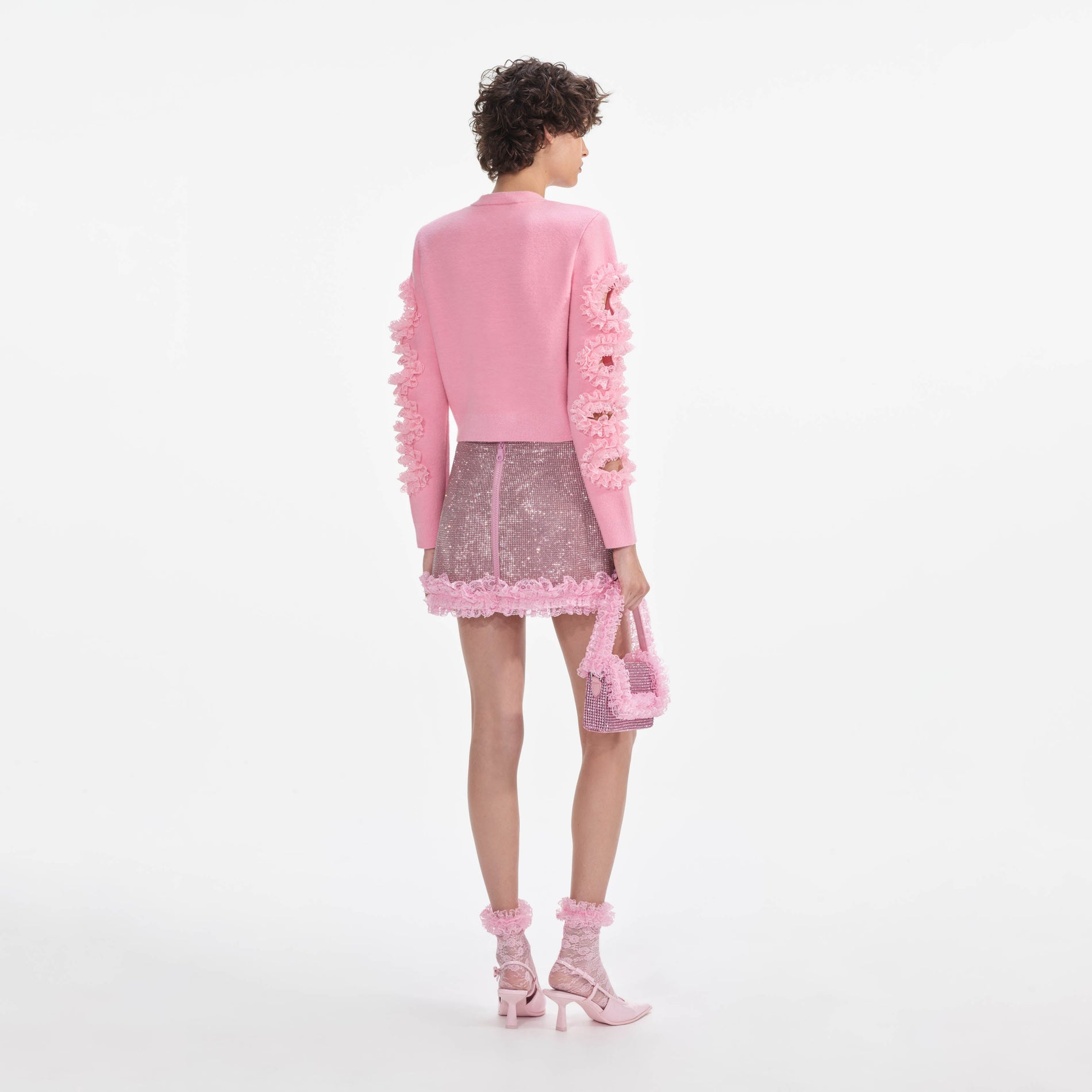 Back view of a woman wearing the Pink Cut Out Lace Detail Cardigan