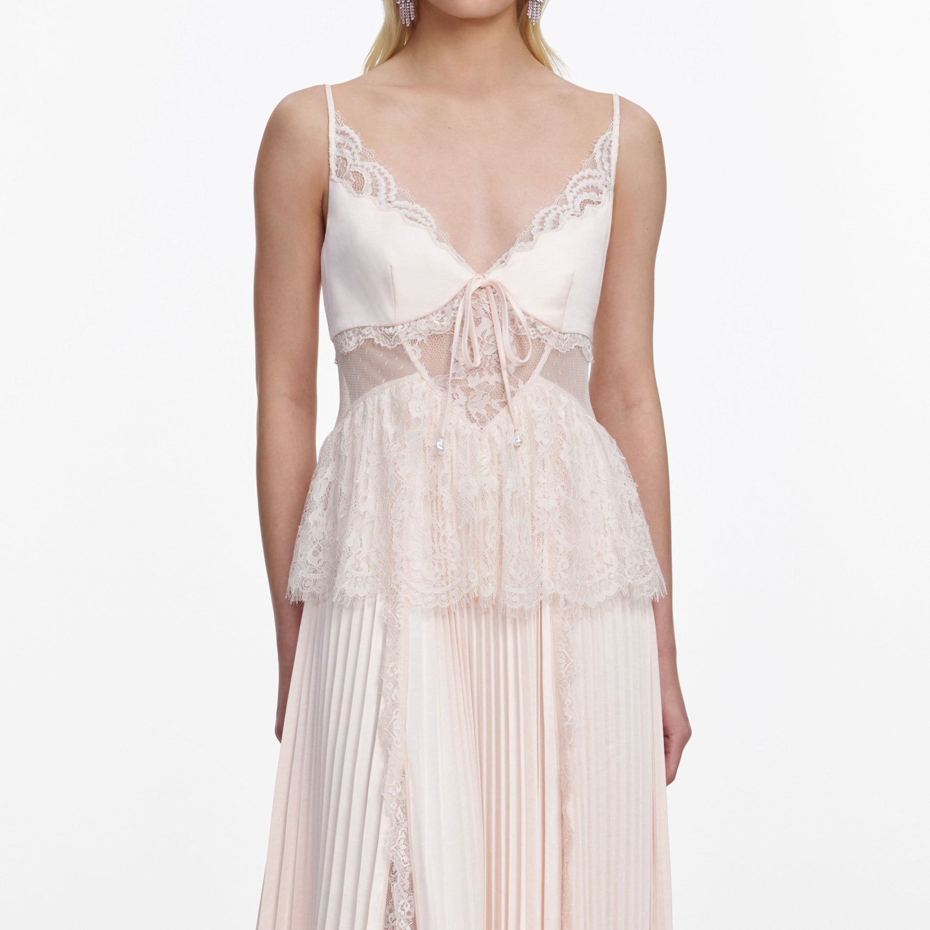 A close up of a woman wearing the Blush Satin Lace Midi Dress