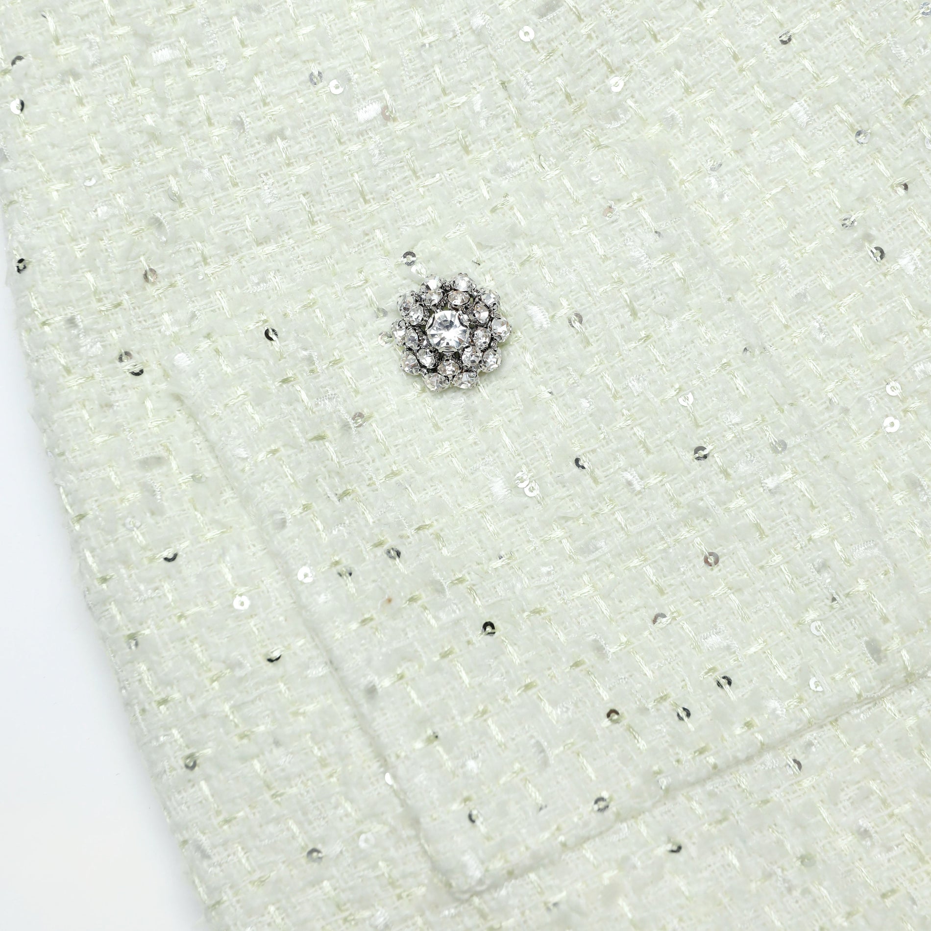 A close up of the fabric for the Lime Boucle Midi Skirt