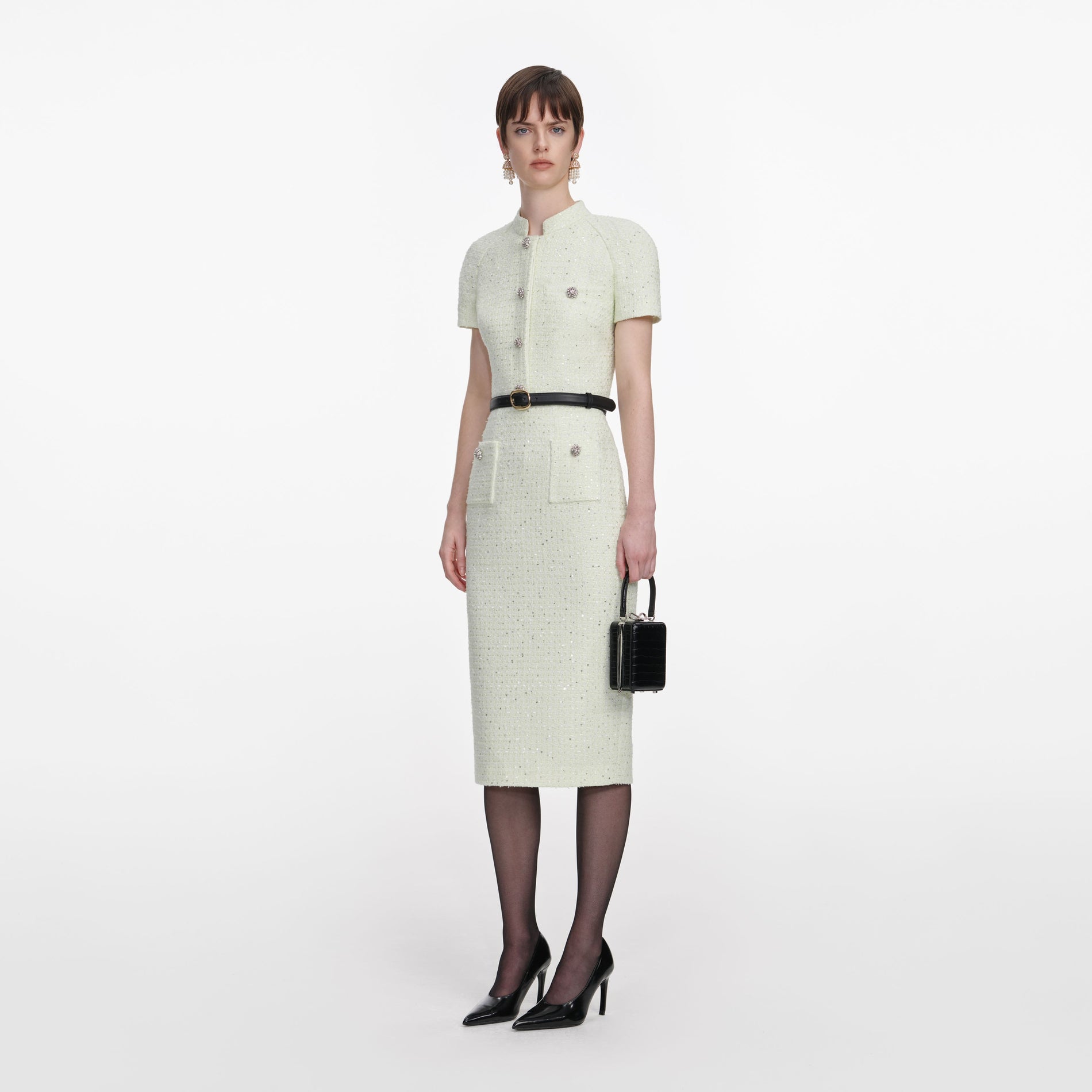 Side view of a woman wearing the Lime Boucle Top